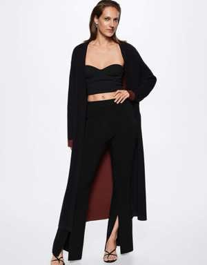 Knitted flared trousers with slits