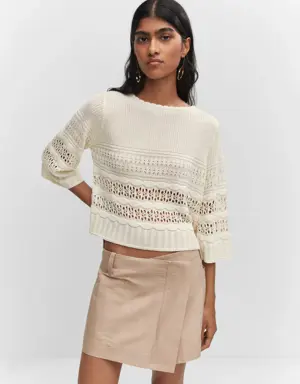 Openwork sweater with flared sleeves