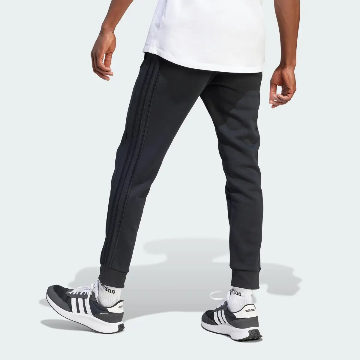 Adidas Essentials Fleece 3-Stripes Tapered Cuff Pants. 2