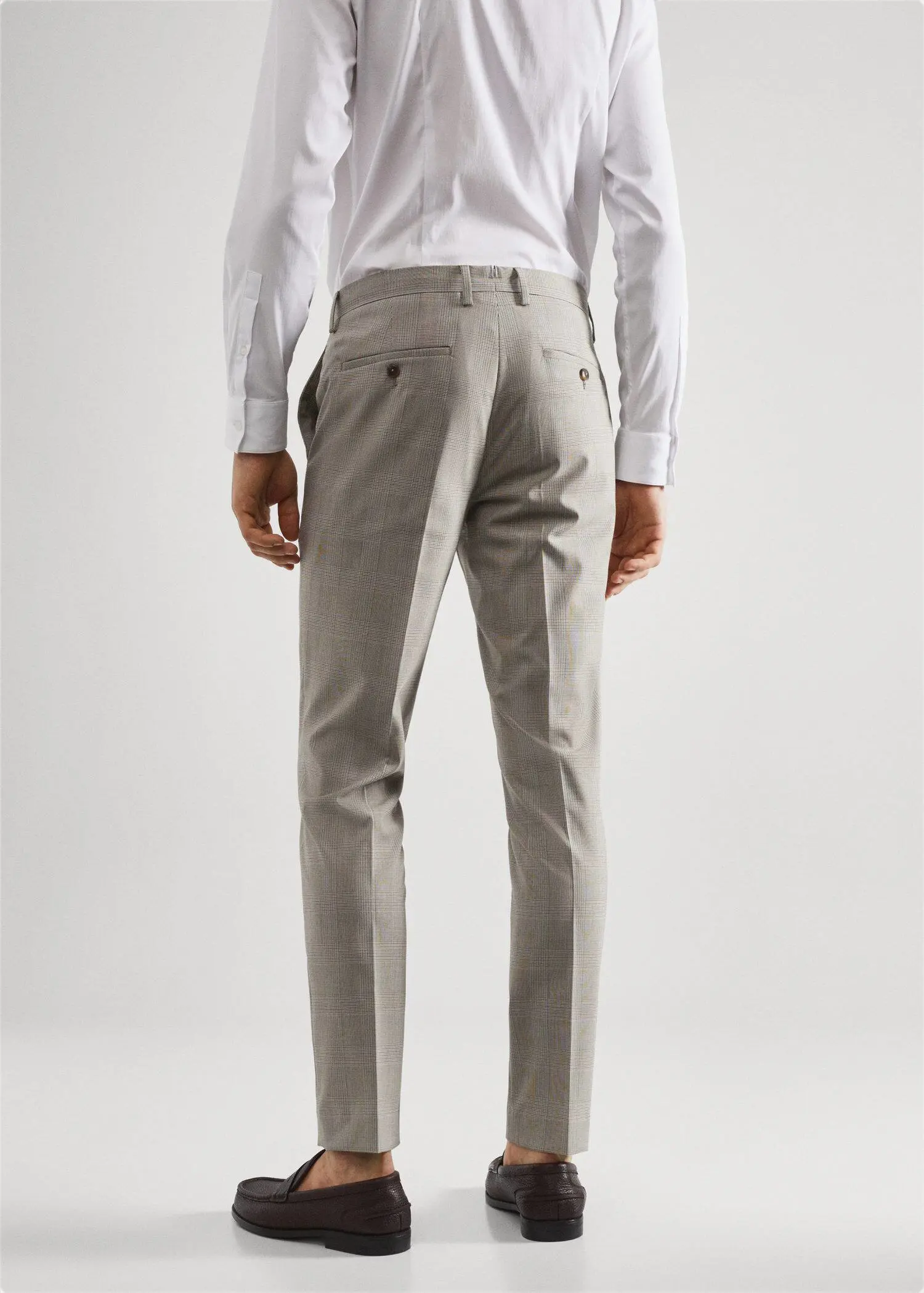 Mango Super slim-fit printed suit pants. a man in a white shirt and a gray suit 