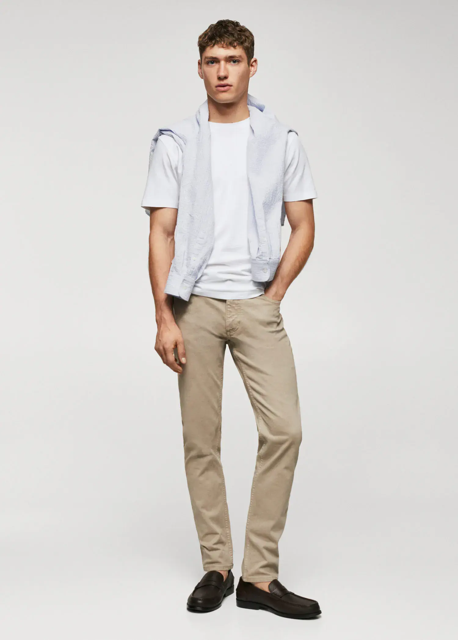 Mango Basic lightweight cotton t-shirt. a young man wearing a white shirt and a white vest. 