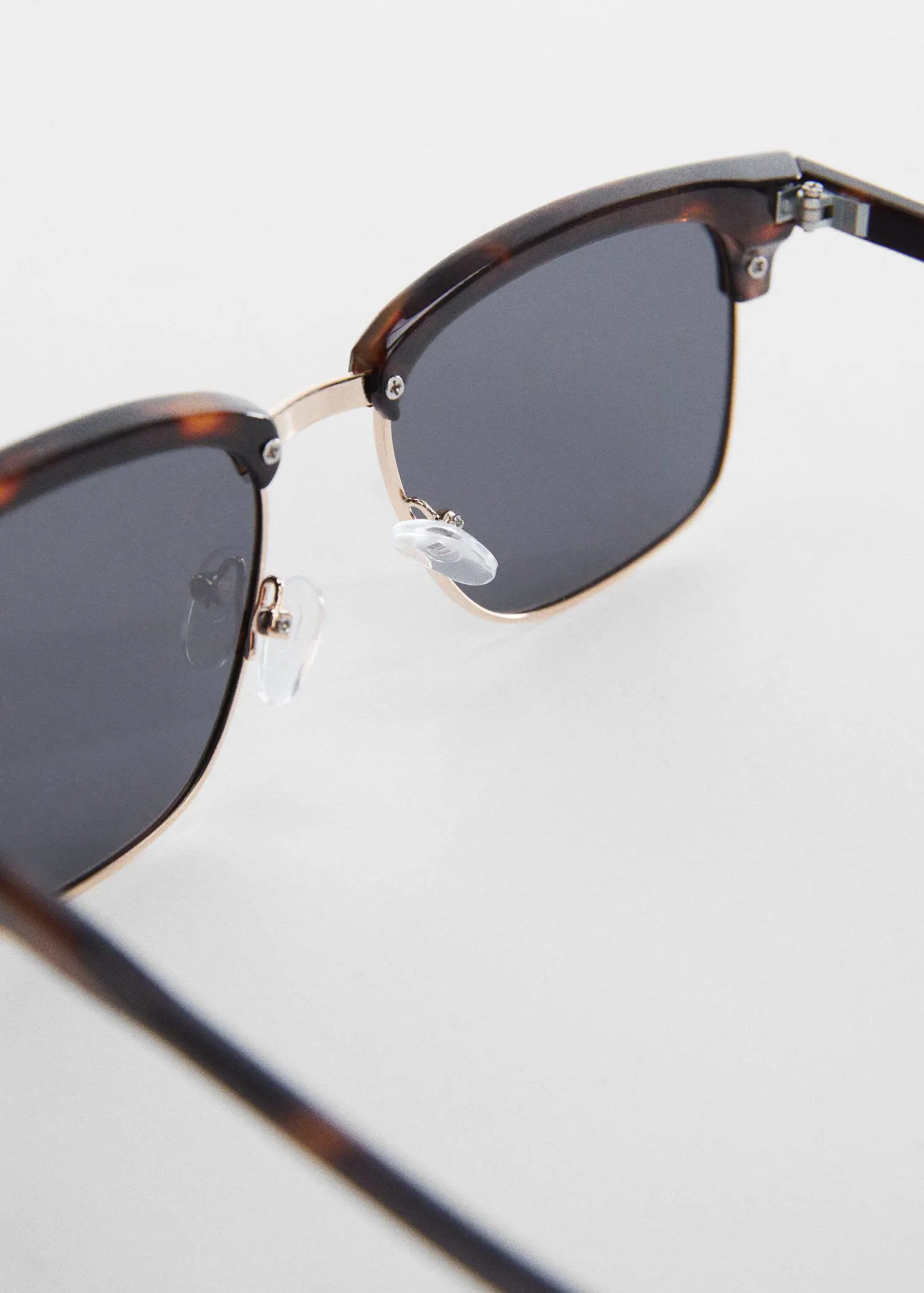 Mango Polarised sunglasses. a close up of a pair of sunglasses. 