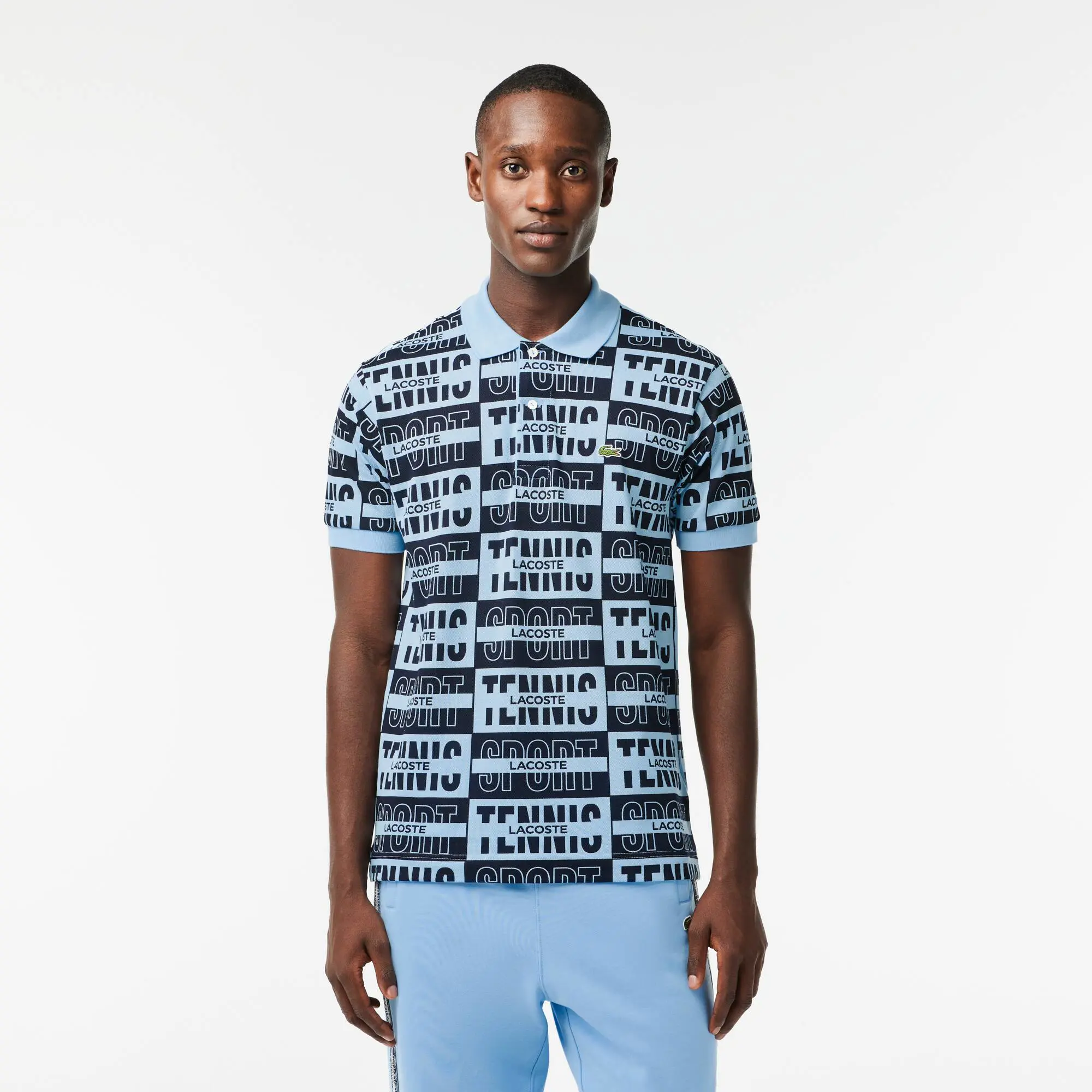 Lacoste Original L.12.12 Two Tone Badge Print Polo Shirt. 1