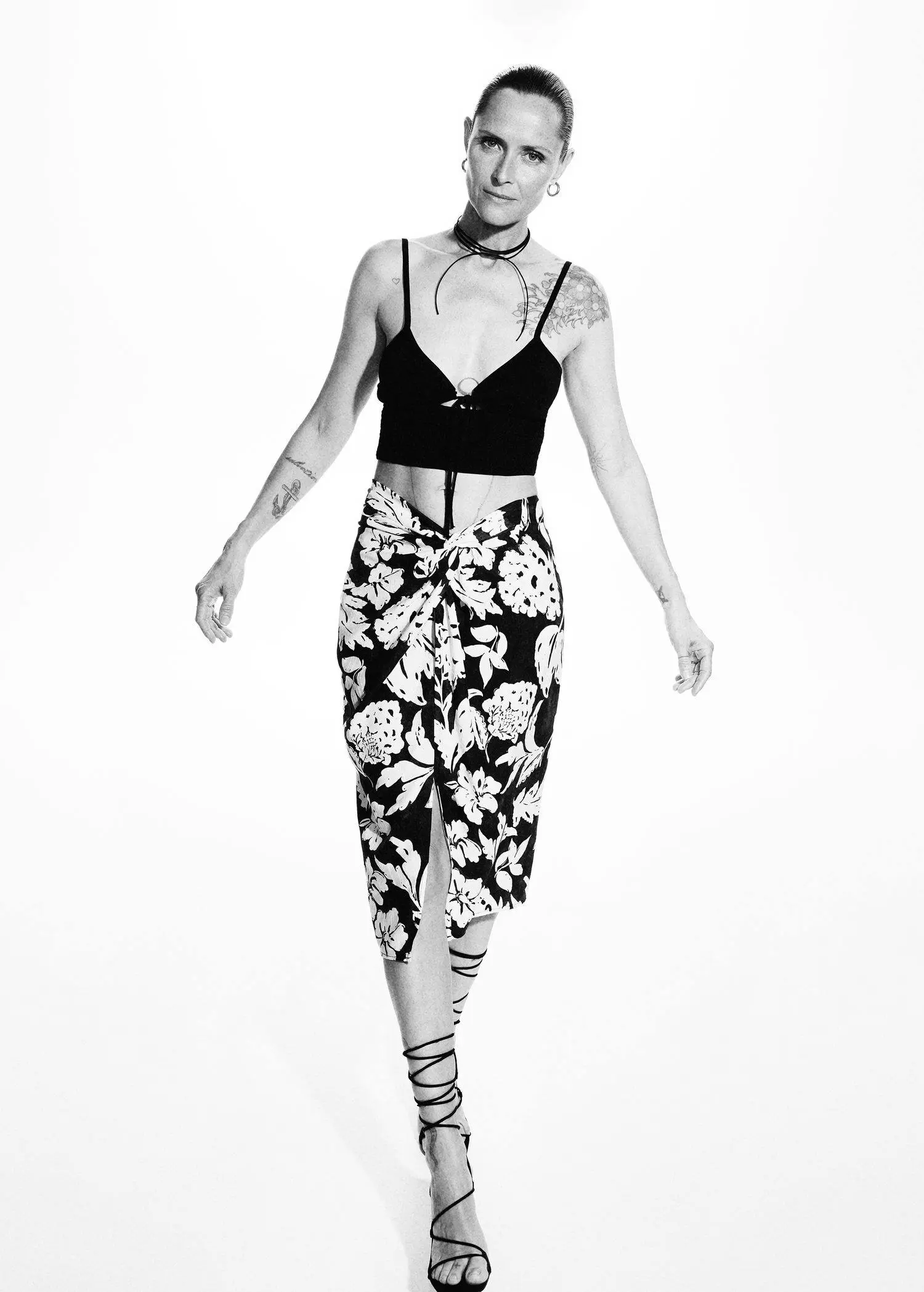 Mango Slit floral skirt. a black and white photo of a woman wearing a skirt. 