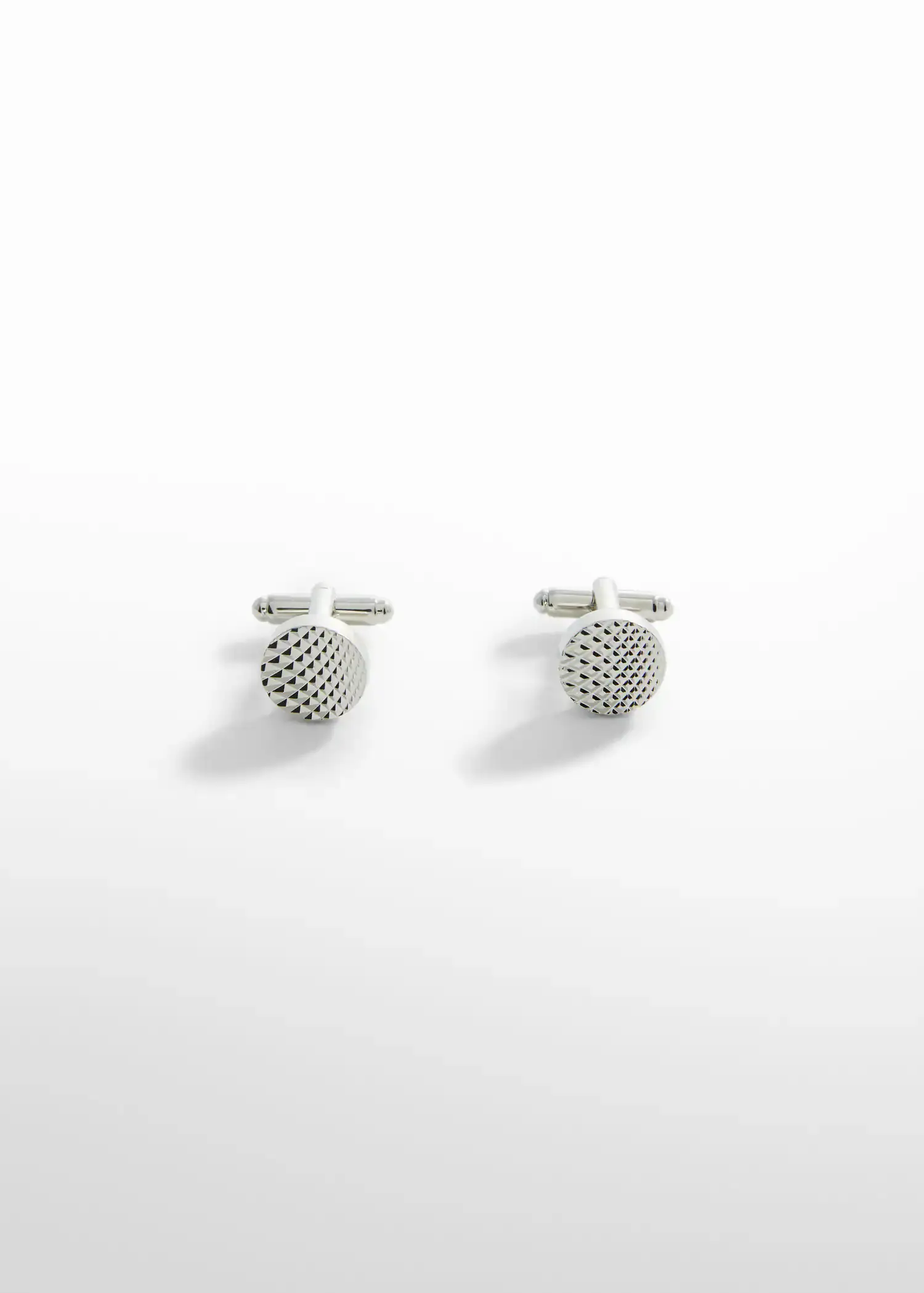 Mango 100% copper geometric cufflinks. a pair of cufflinks on top of a white surface. 