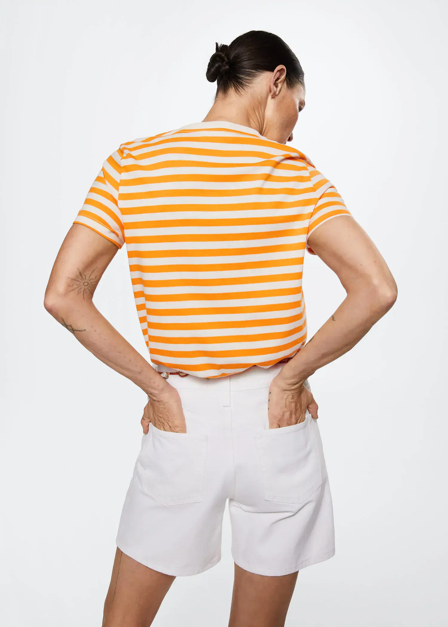 Mango Striped cotton T-shirt. a person with their hands on their hips. 