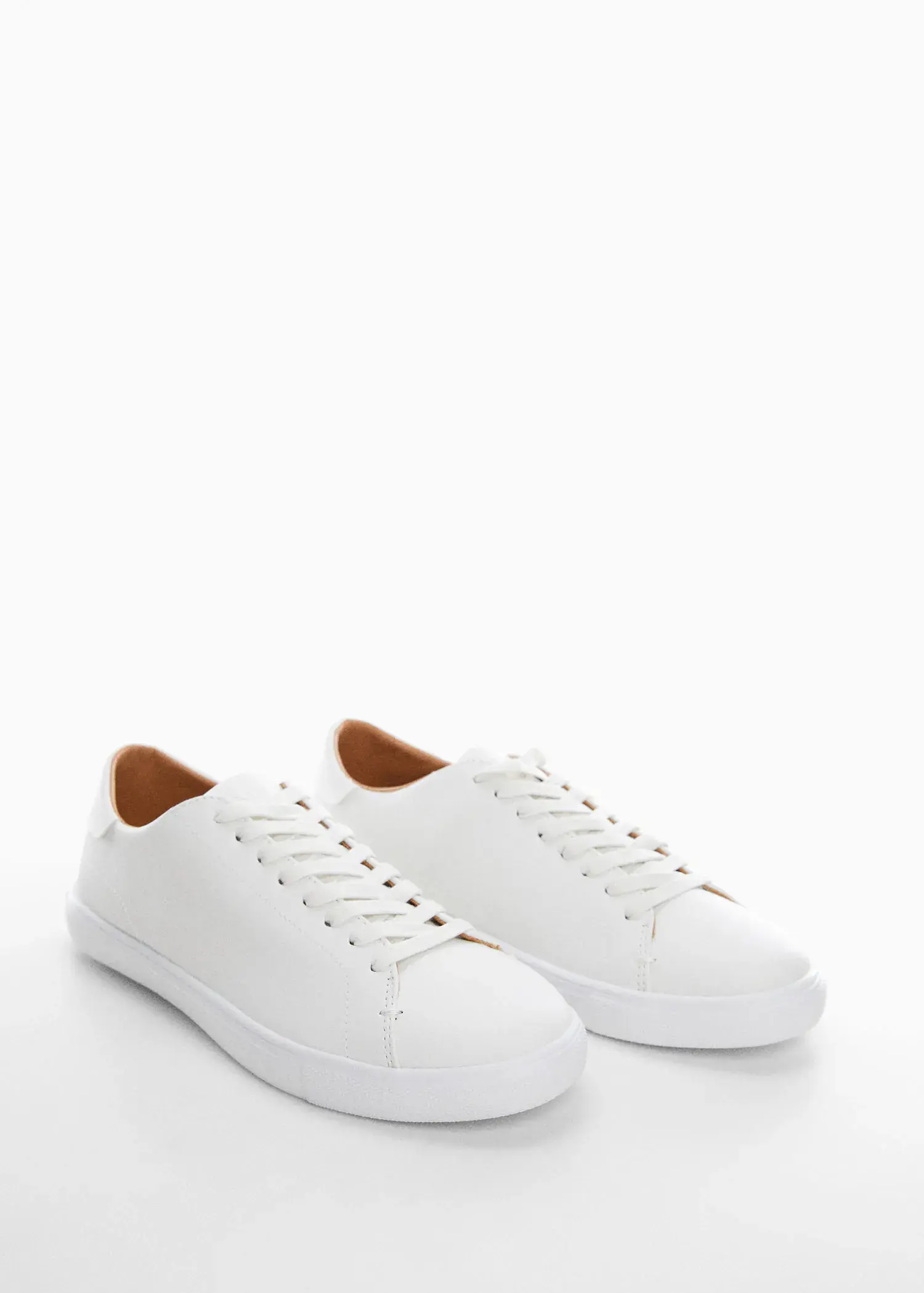 Mango Monocoloured leather sneakers. a pair of white sneakers on a white surface. 