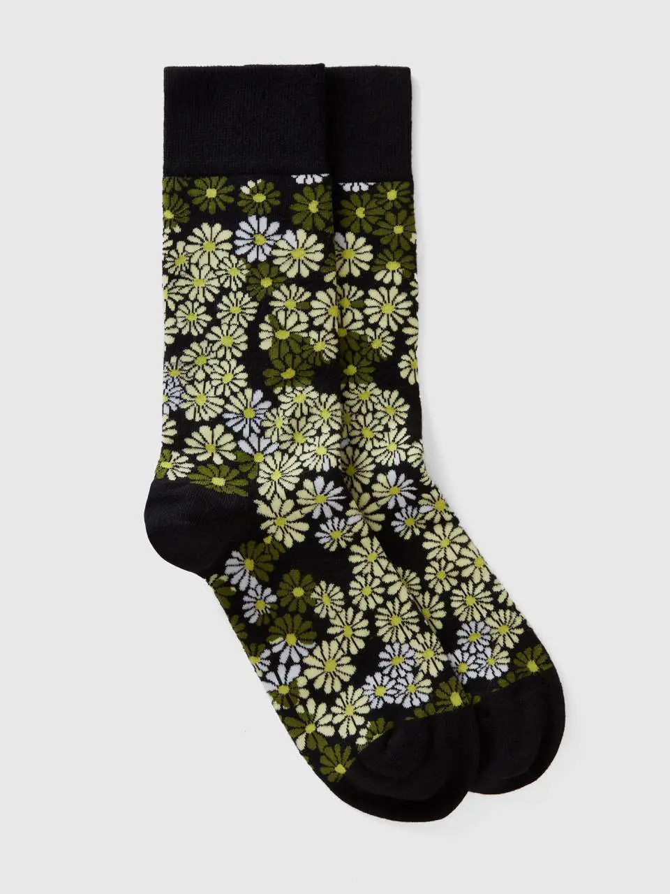Benetton long black and yellow floral socks. 1