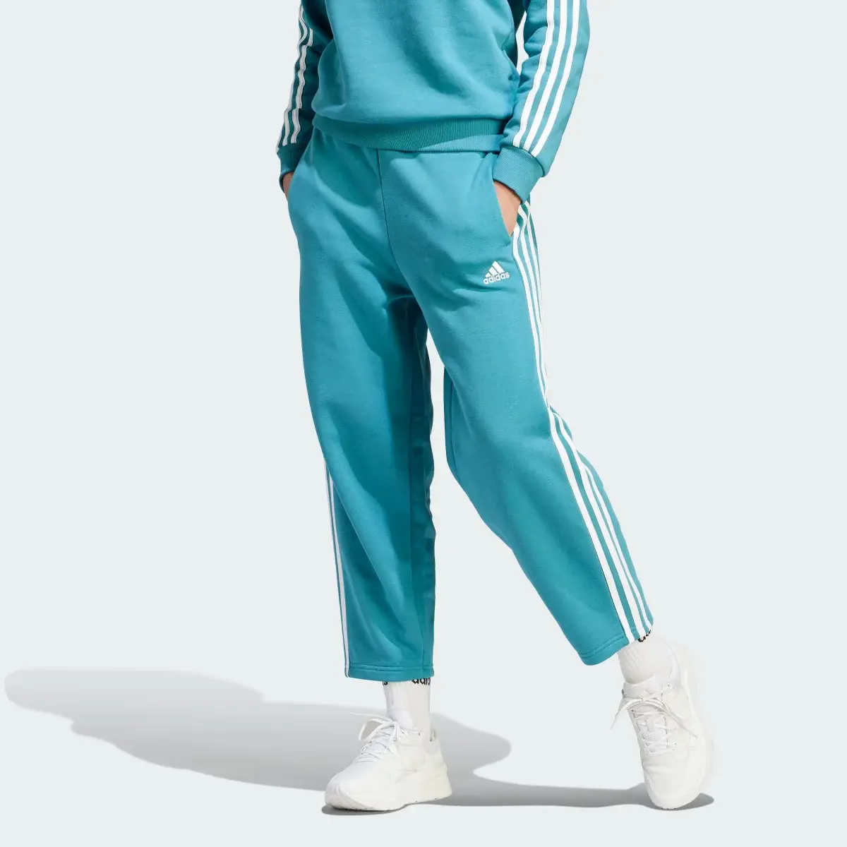 Adidas Essentials 3-Stripes Open Hem Fleece Pants. 1