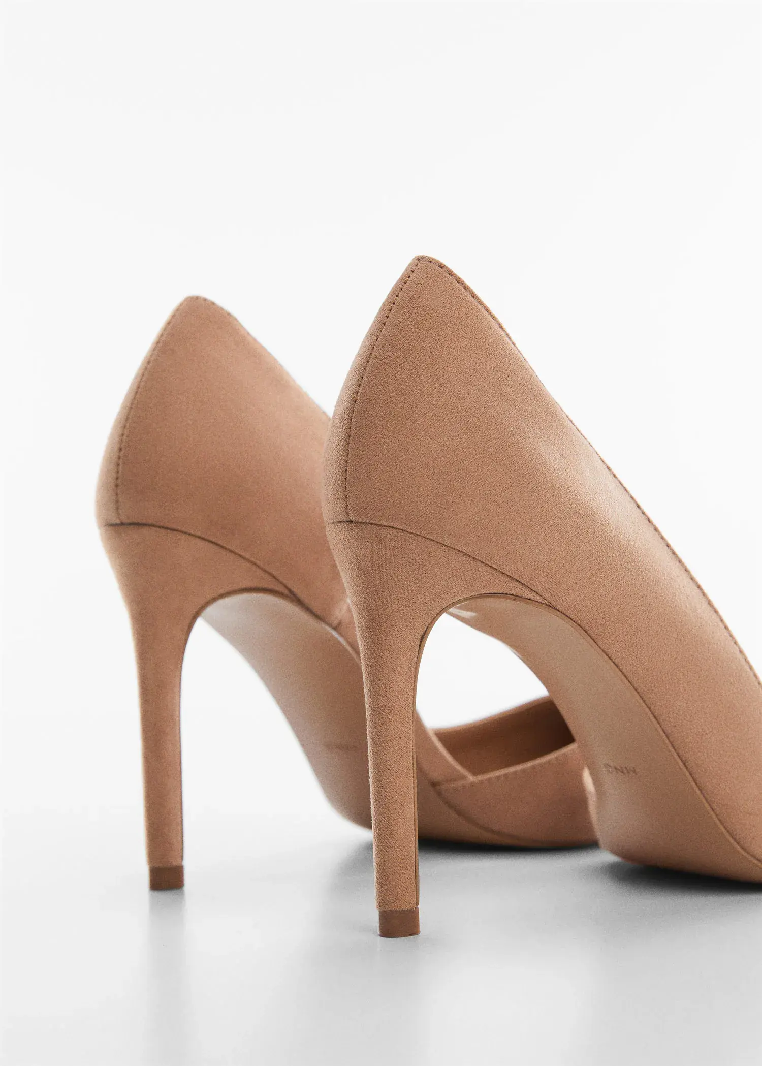 Mango Asymmetrical heeled shoes. a close up of a pair of high heeled shoes 