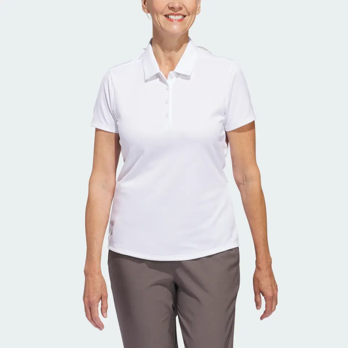 Adidas Women's Solid Performance Short Sleeve Polo Shirt. 1