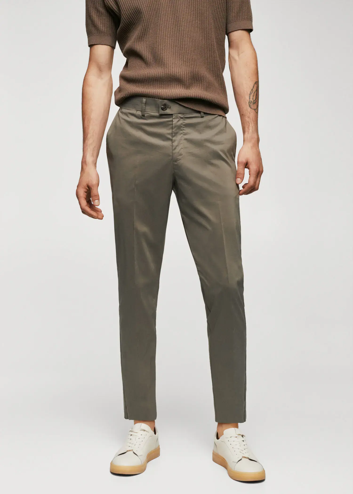 Mango Lightweight cotton pants. a man wearing a pair of khaki colored pants. 