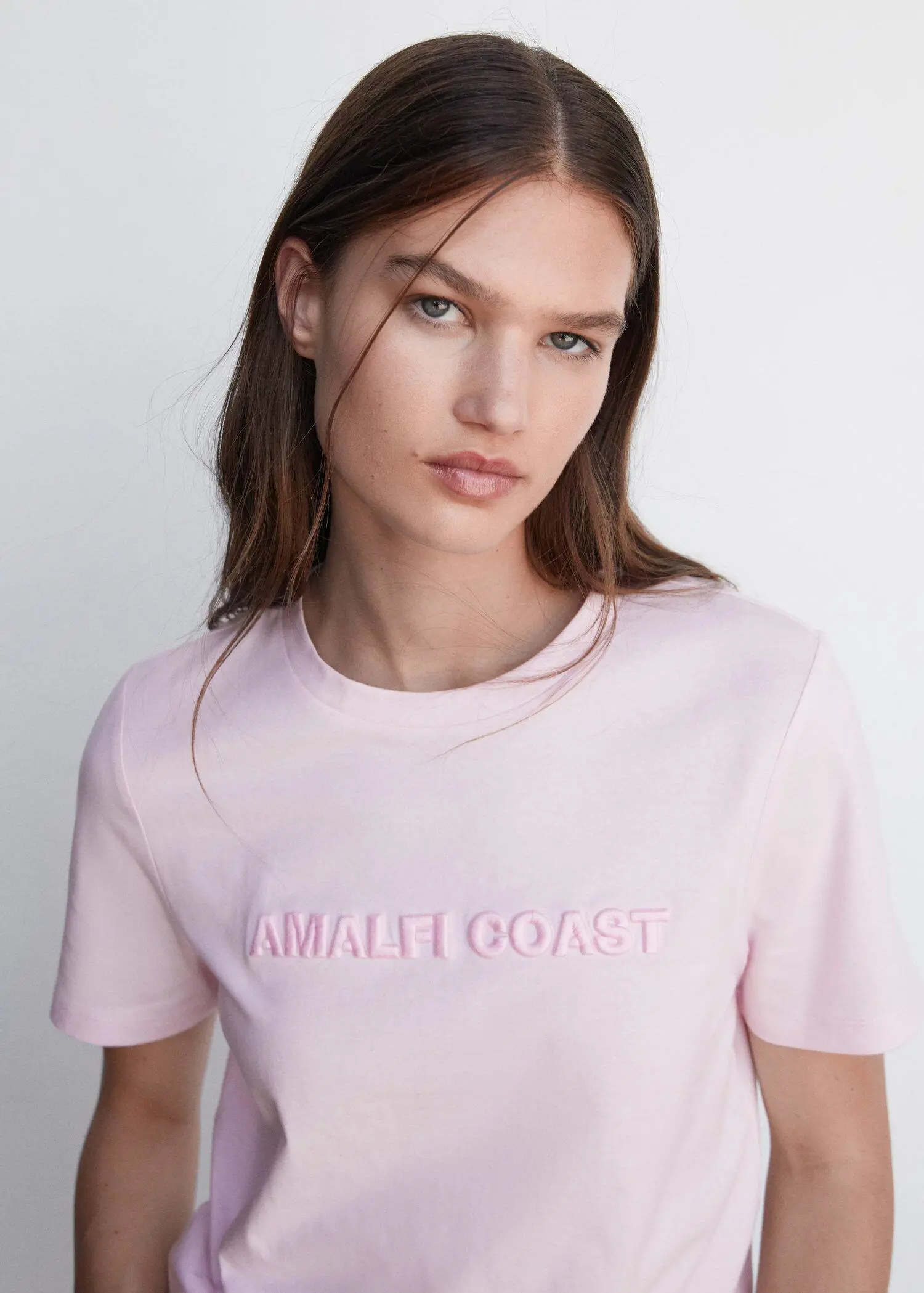 Mango Embroidered message T-shirt. a beautiful young woman wearing a pink t-shirt. 