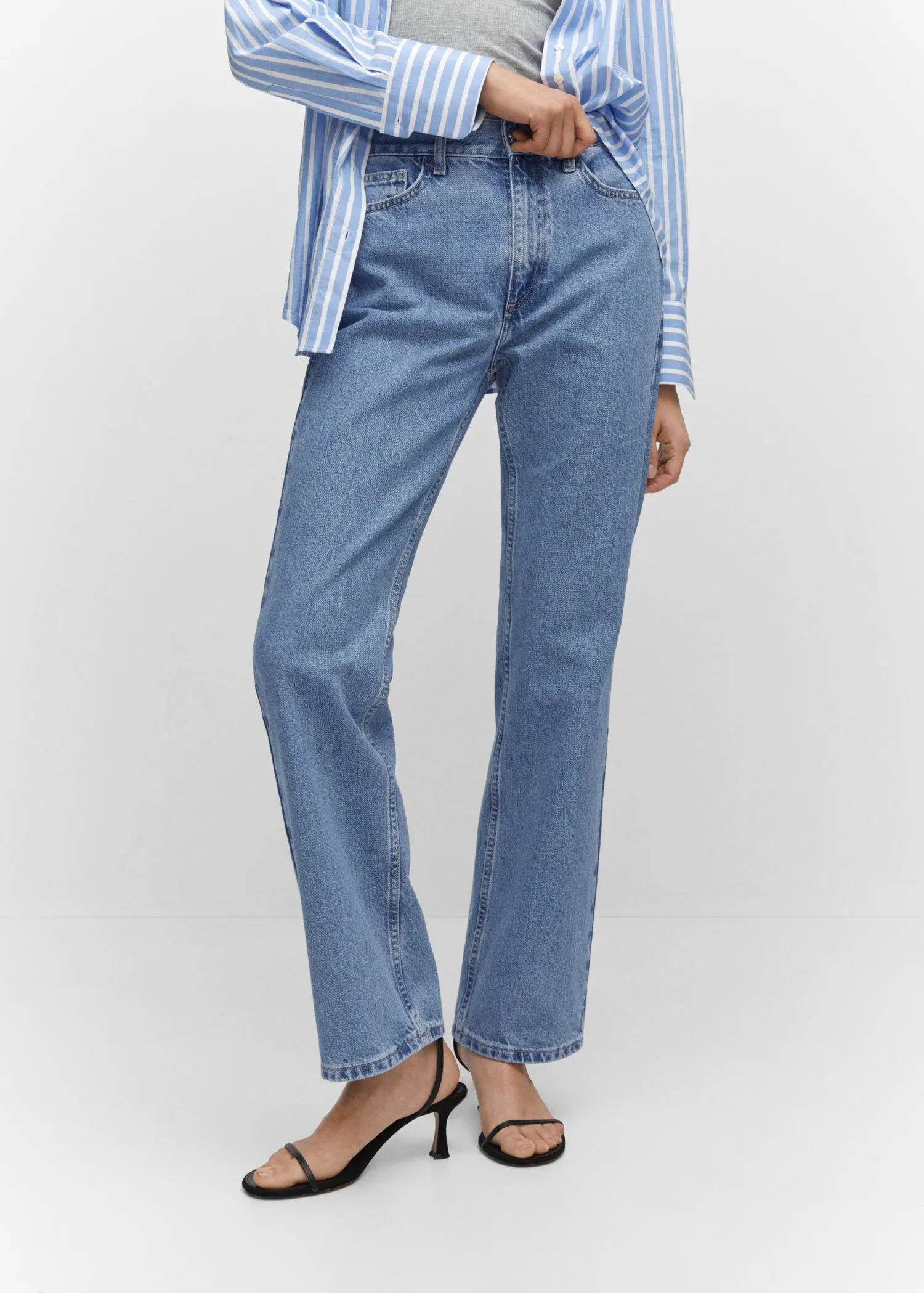 Mango Mid-rise straight jeans. a person wearing a pair of blue jeans. 