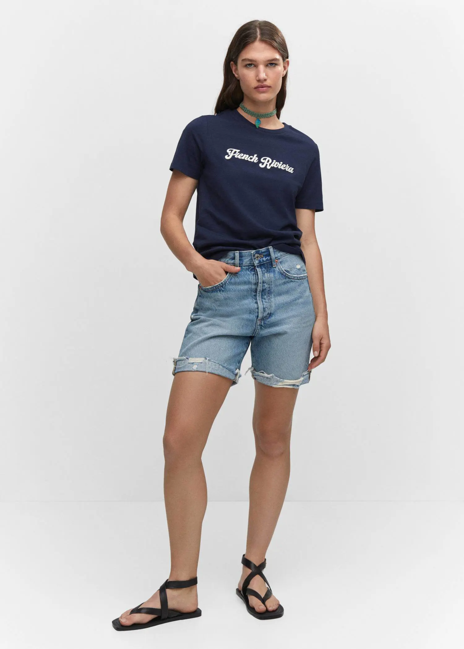 Mango Embroidered message T-shirt. a woman wearing a t-shirt and denim shorts. 