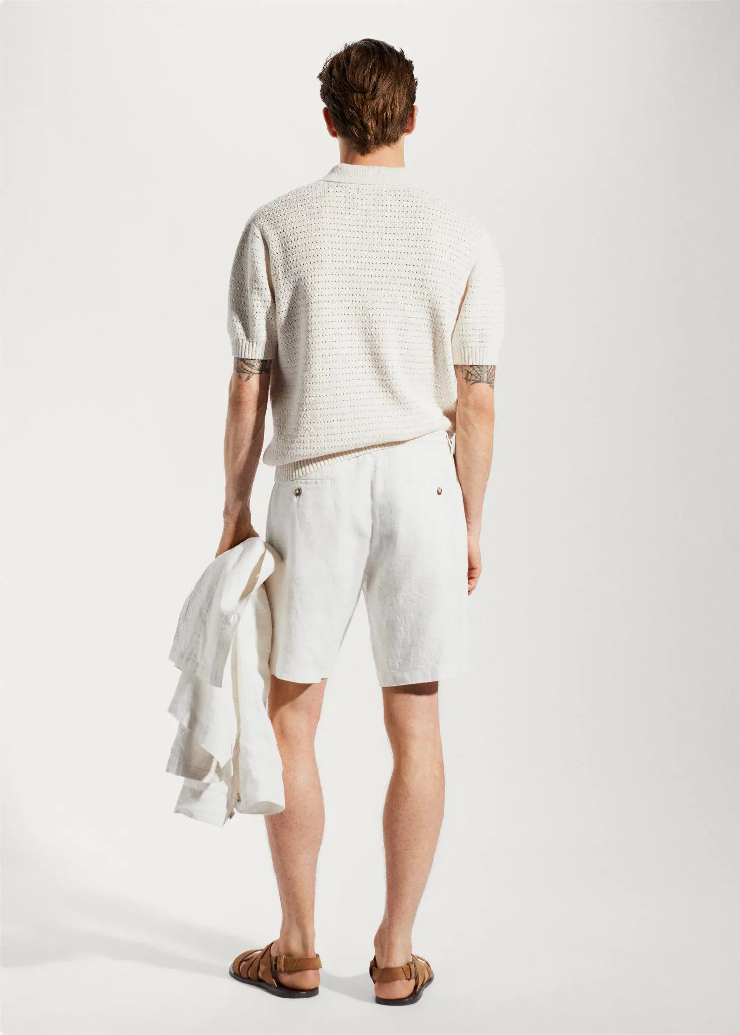 Mango 100% linen bermuda shorts with drawstring. a man in white shorts and a white sweater. 