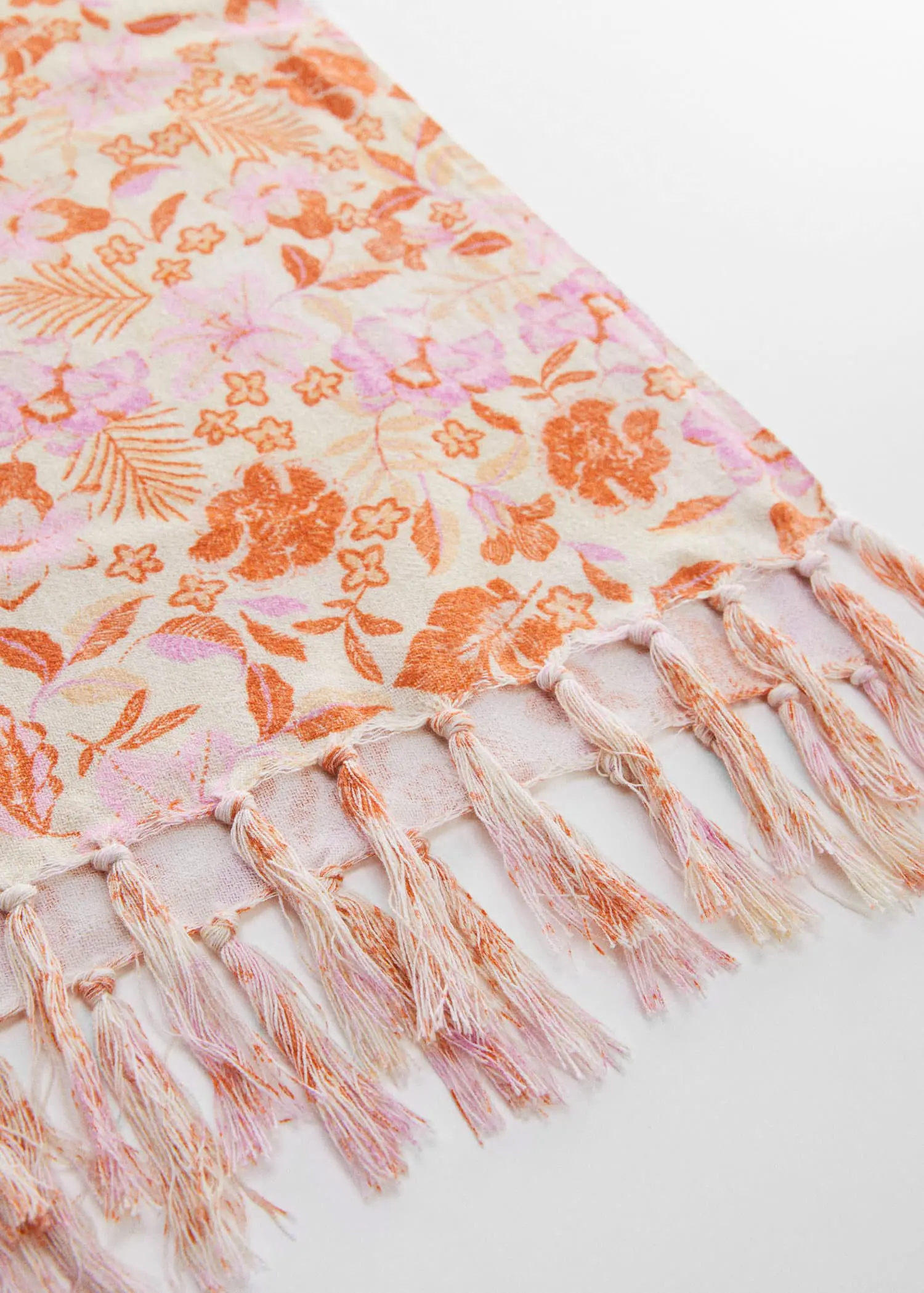 Mango 100% Cotton flower towel. a close-up view of a pink and orange blanket. 