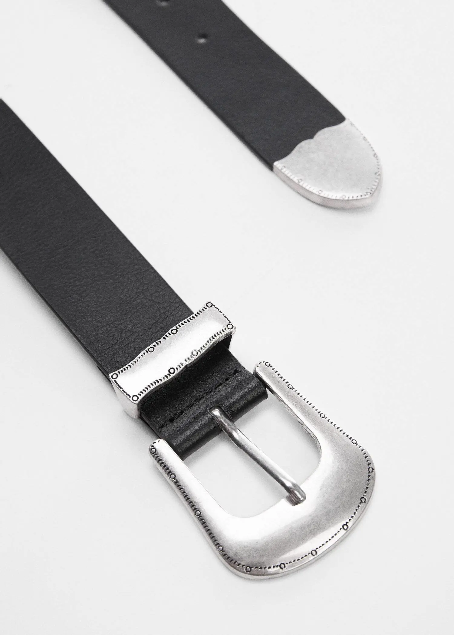 Mango Engraved buckle belt. a close-up of a black belt with a silver buckle. 