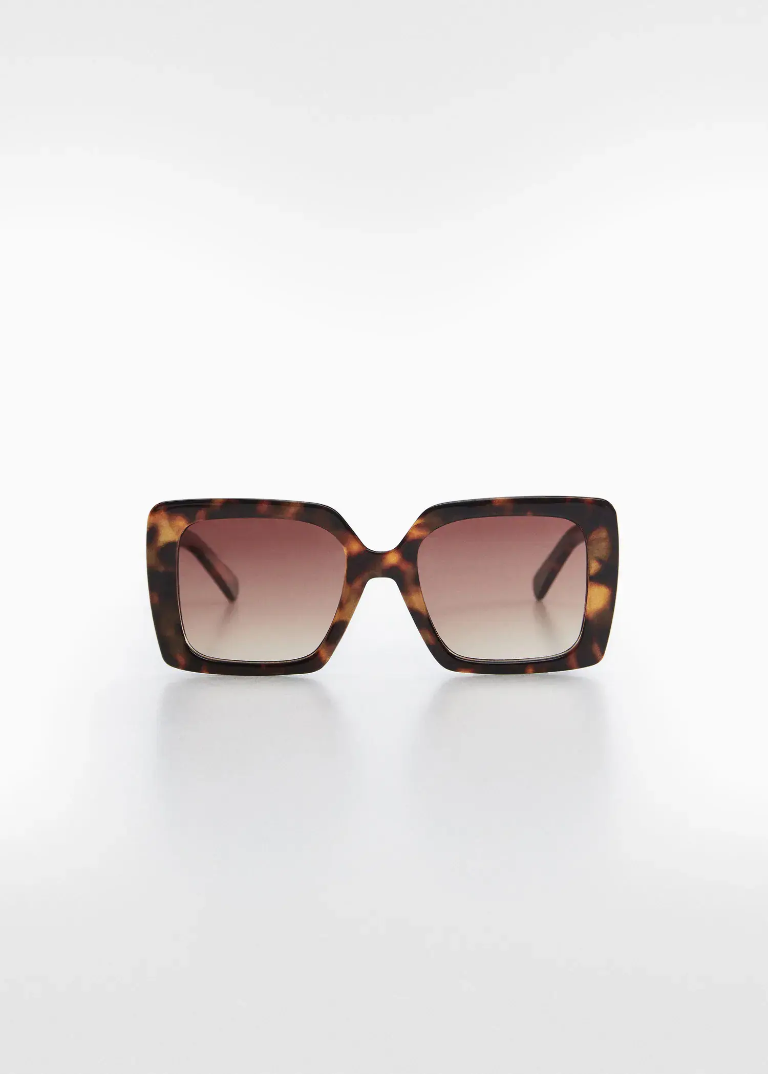Mango Tortoiseshell square sunglasses. a pair of sunglasses sitting on top of a white table. 