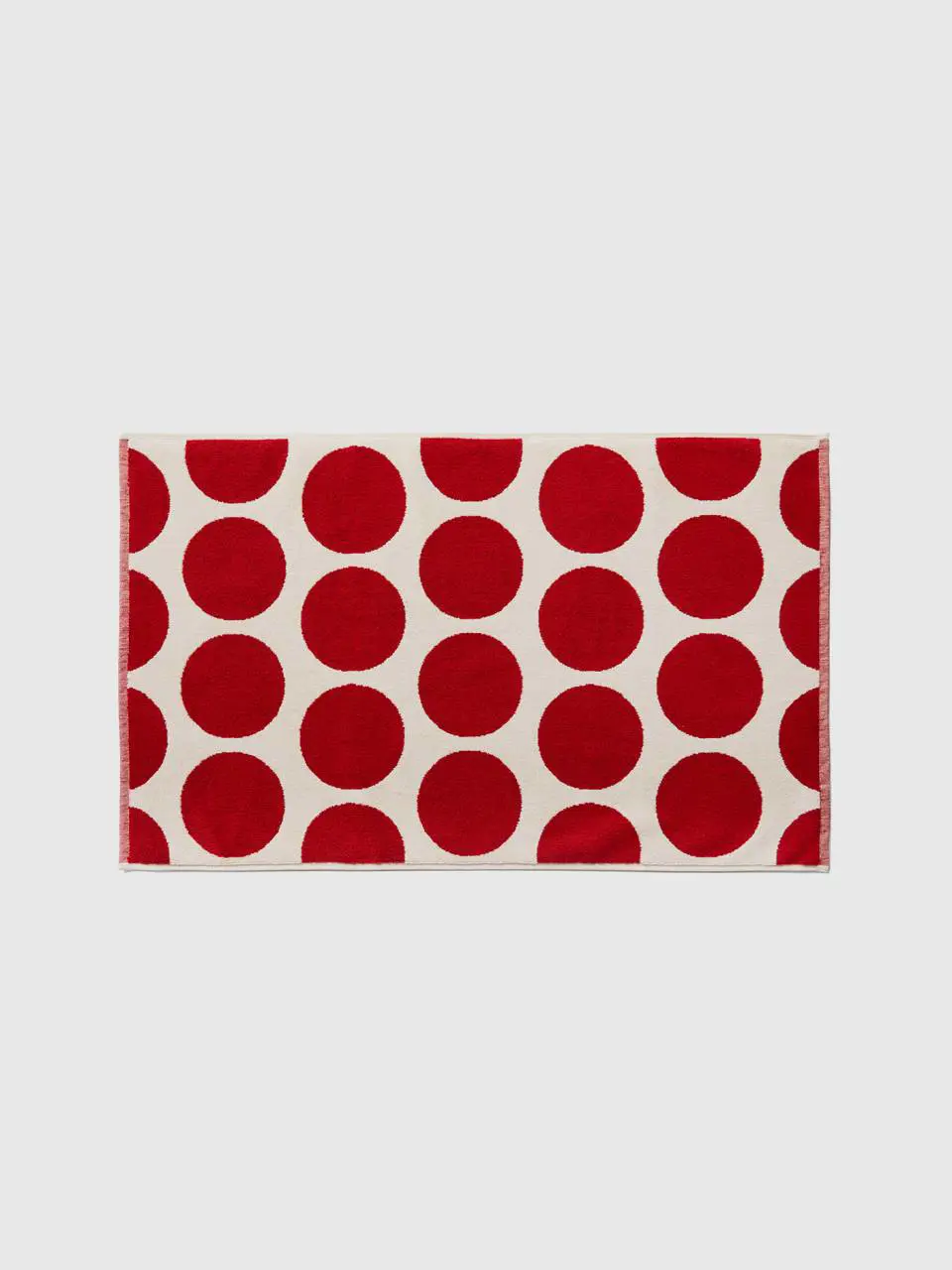 Benetton white bathroom rug with red polka dots. 1