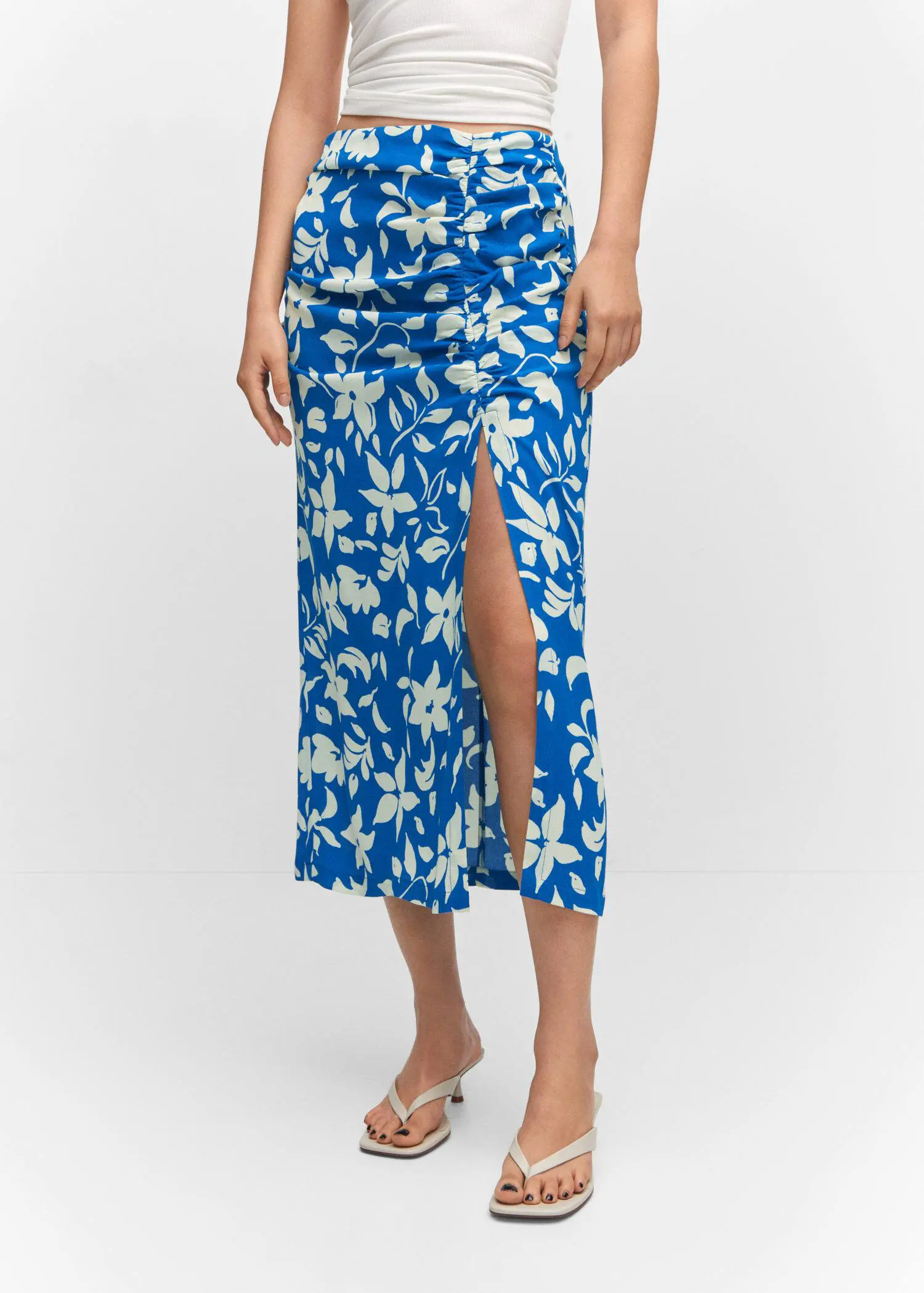 Mango Printed skirt with slit. a woman wearing a blue and white floral skirt. 