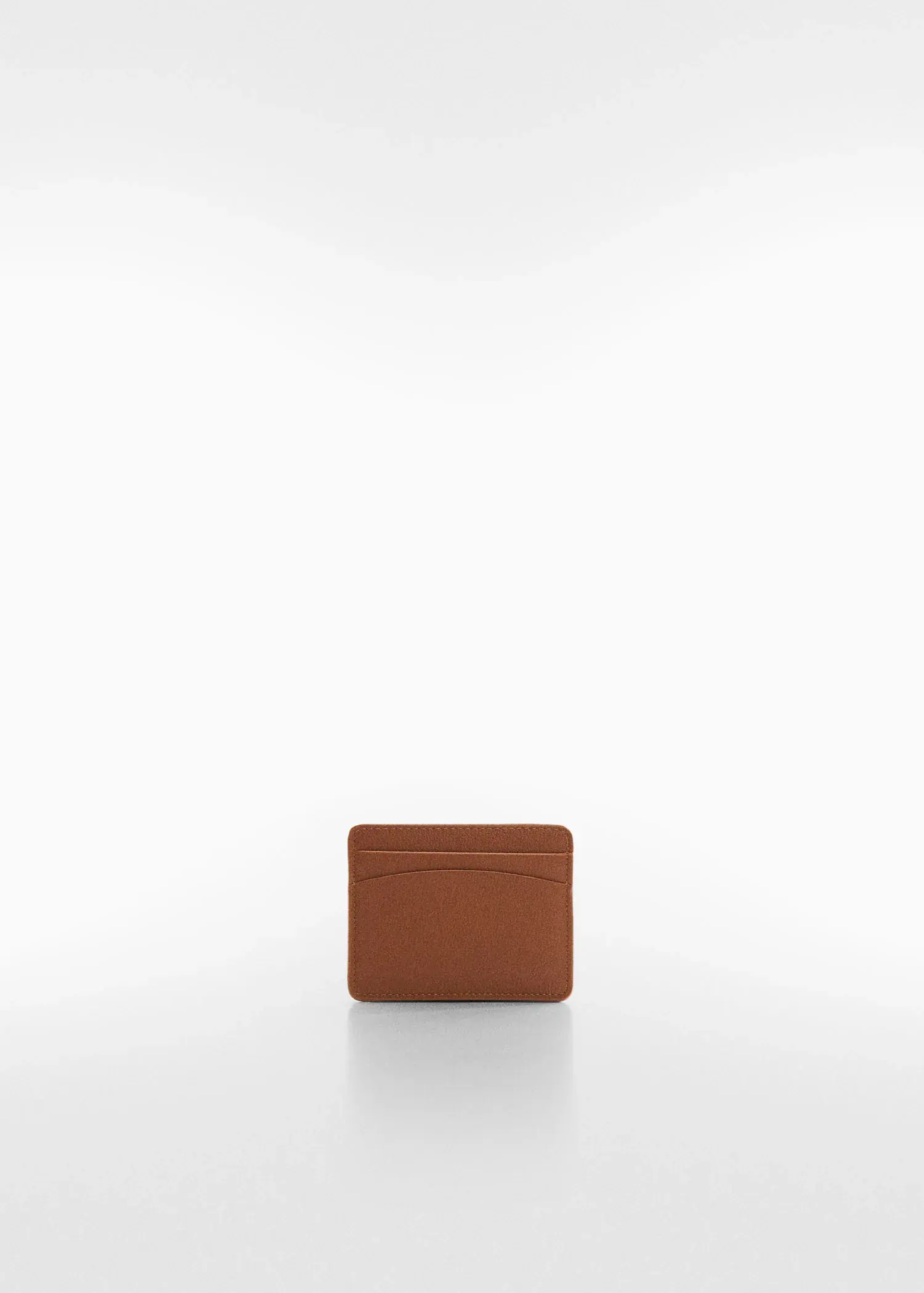 Mango Anti-contactless leather-effect card holder. a brown wallet sitting on top of a white table. 