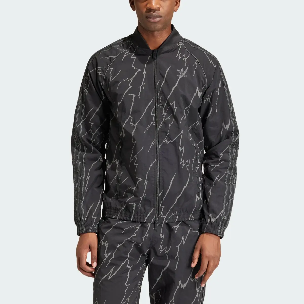 Adidas Allover Print SST Track Top. 1