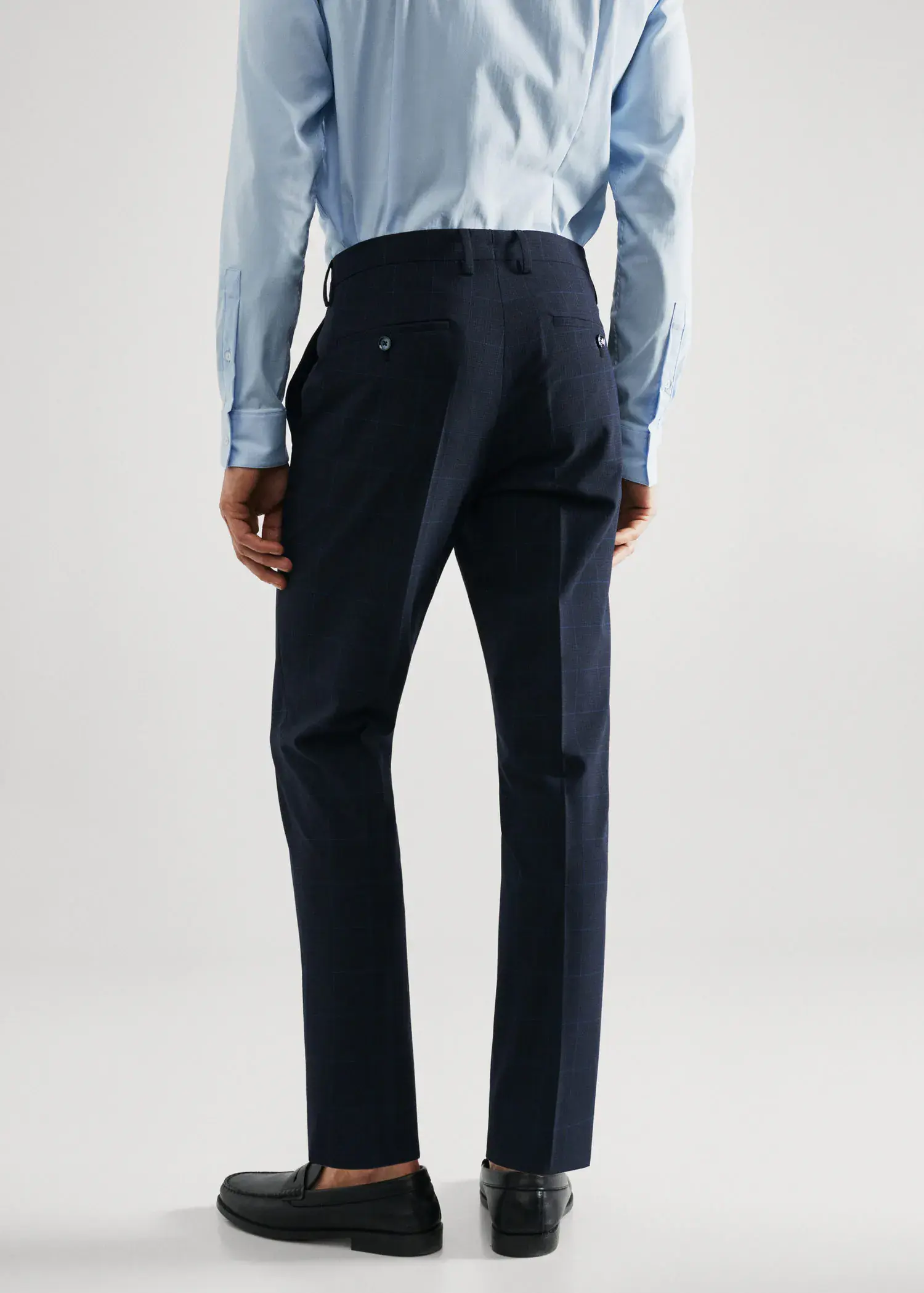 Mango Super slim-fit Tailored check trousers. a man wearing a suit and a tie. 