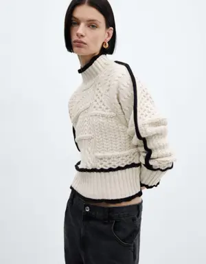 Sweter z warkoczami i kontrastowym obszyciem