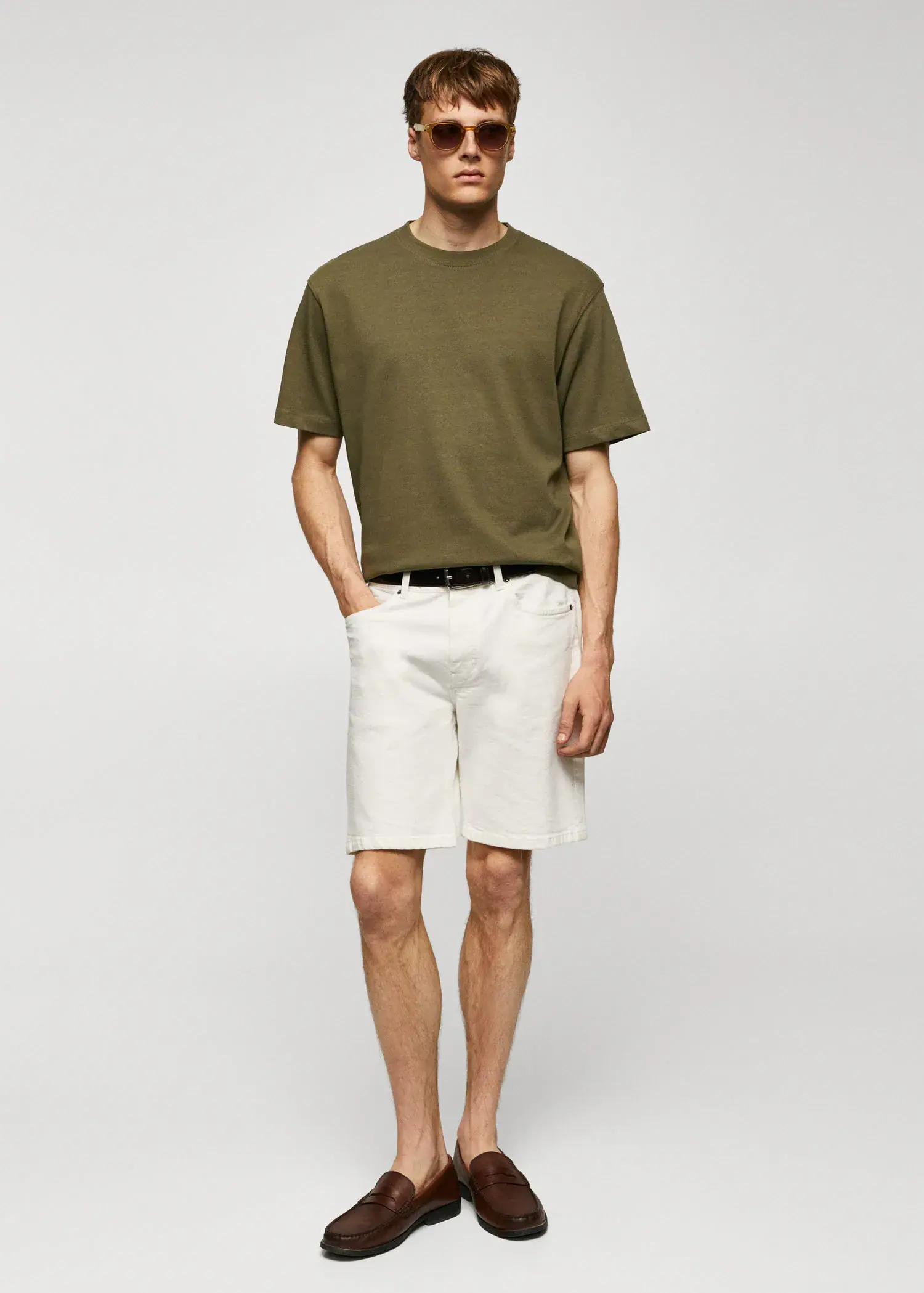 Mango Basic 100% cotton relaxed-fit t-shirt. a man wearing a green shirt and white shorts. 