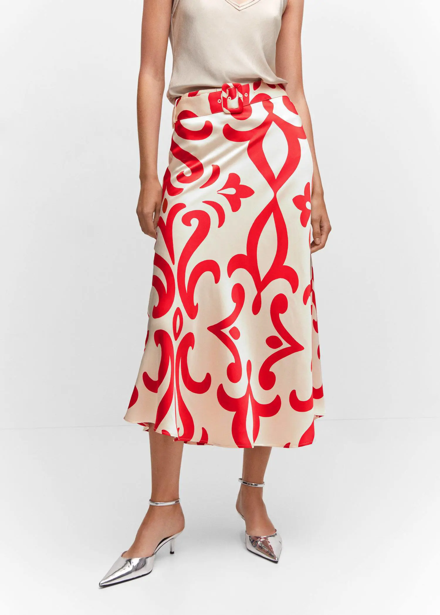 Mango Belt printed skirt. a woman wearing a red and white patterned skirt. 