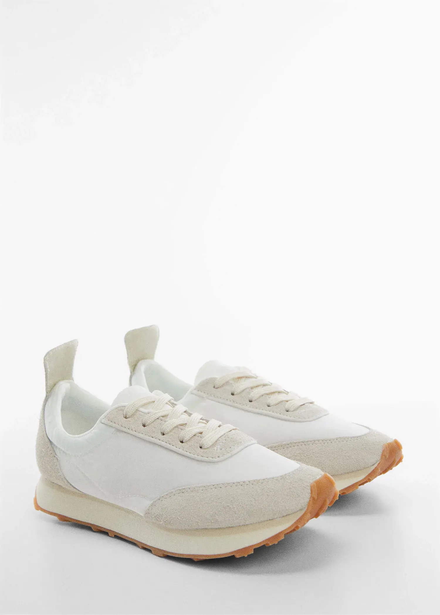 Mango Contrast panel sneakers. a pair of white sneakers on a white surface. 