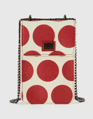 white cell phone holder with red polka dots
