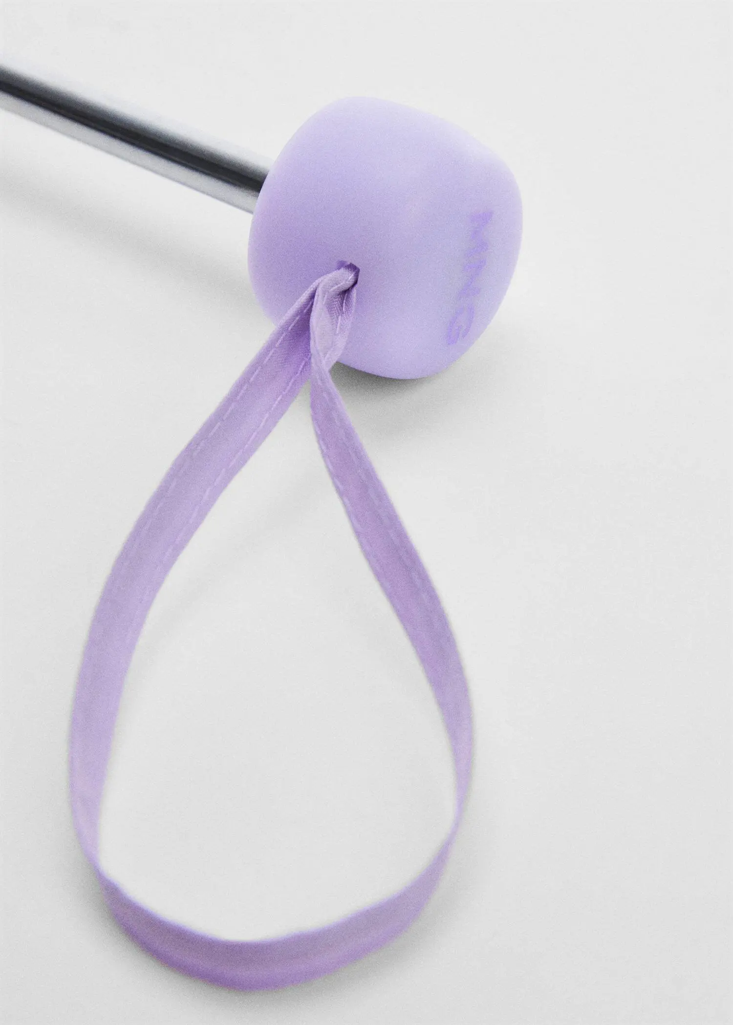 Mango Plain folding umbrella. a close-up of a ball of yarn tied with a ribbon. 