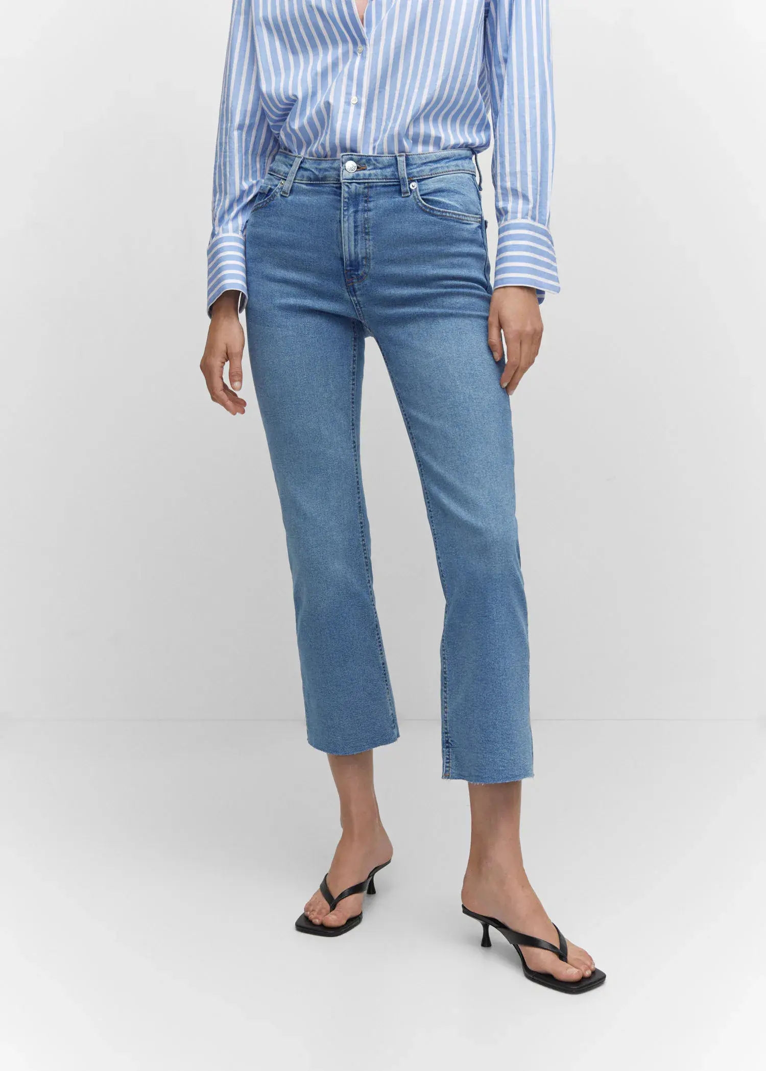 Mango Crop flared jeans. a woman wearing a pair of blue jeans. 