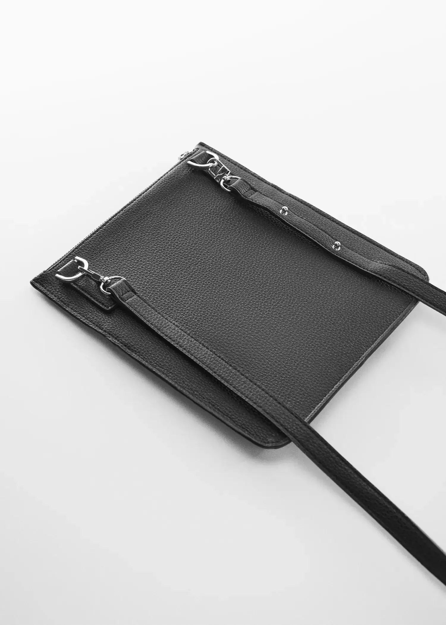 Mango Leather effect zippered shoulder bag. a black bag is laying on the ground. 