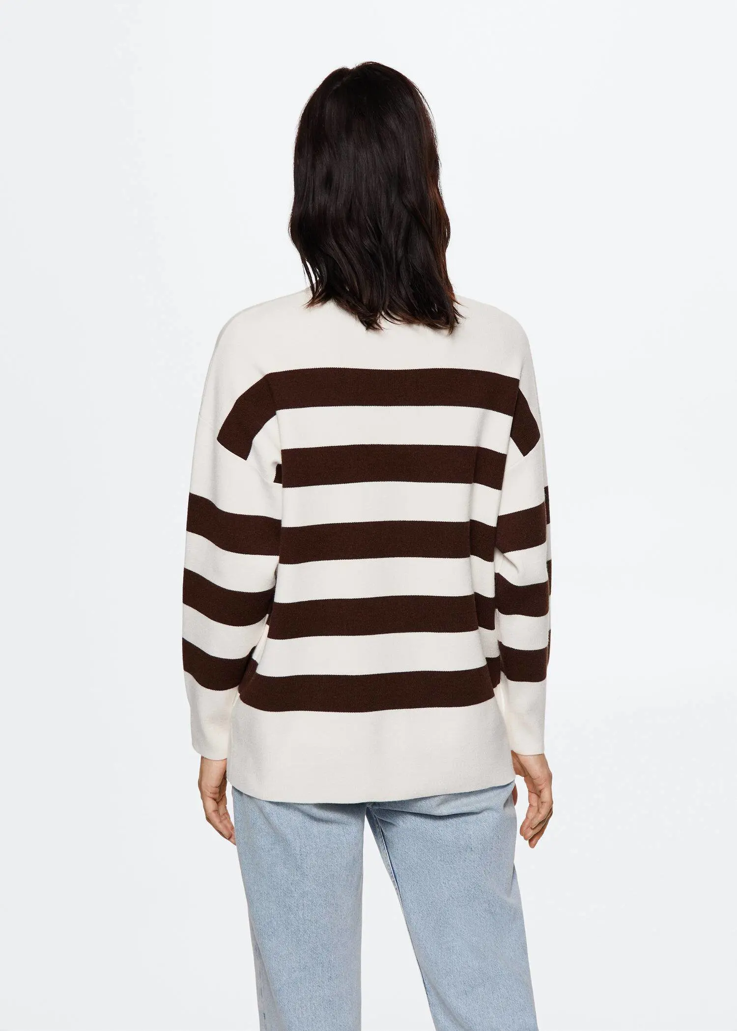 Mango Striped knit sweater. a person wearing a striped sweater and jeans. 