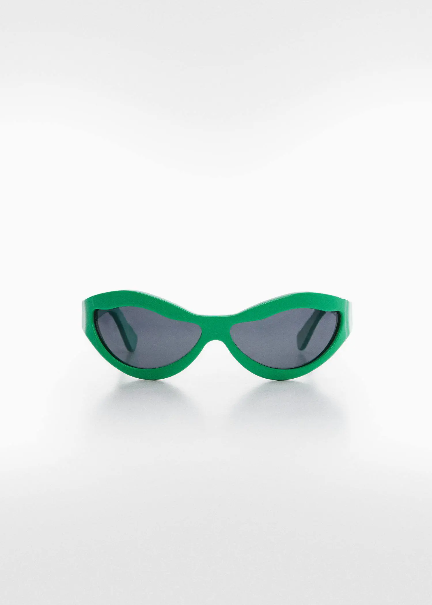 Mango Irregular crystals sunglasses. a pair of green sunglasses sitting on top of a table. 