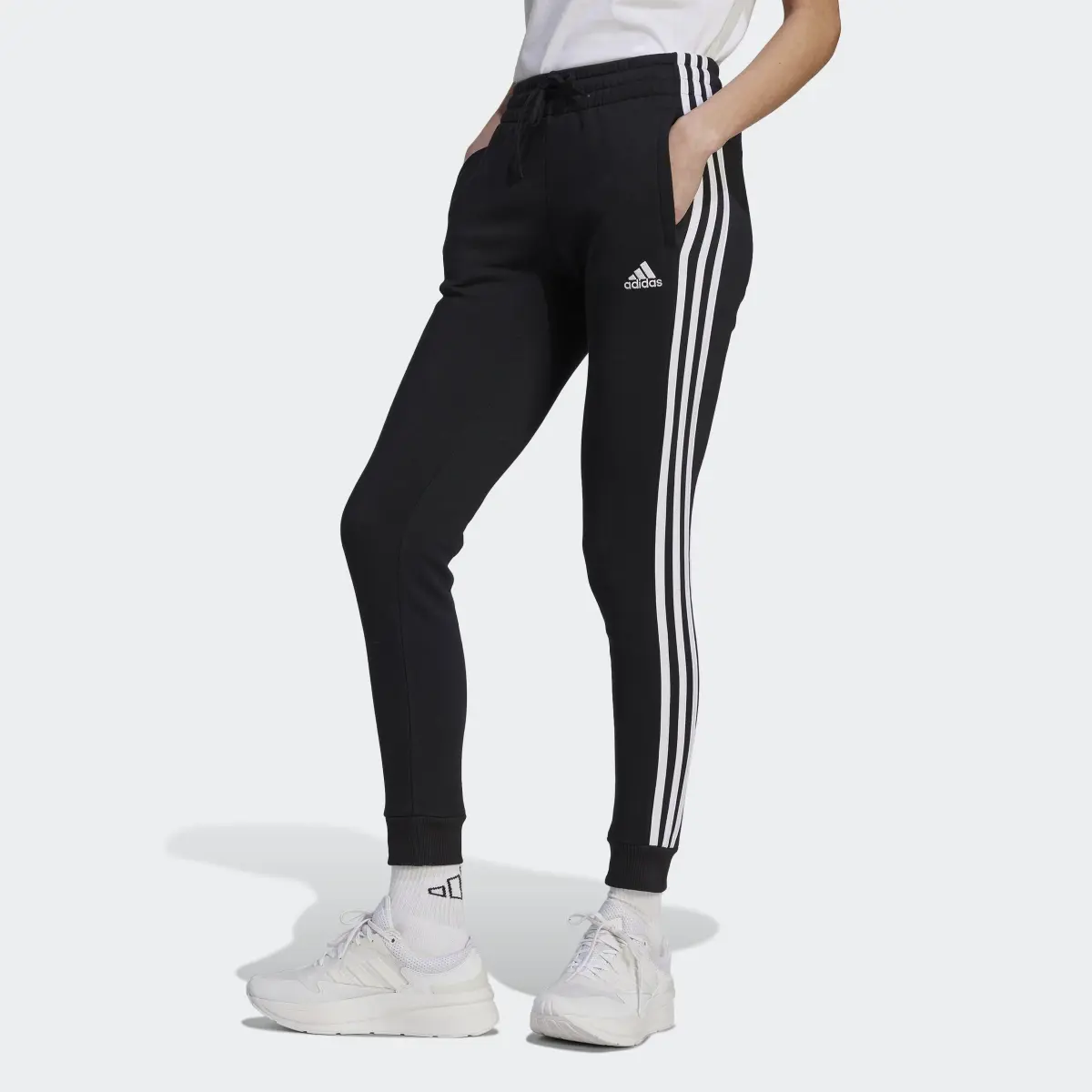 Adidas Essentials 3-Stripes Fleece Pants. 1