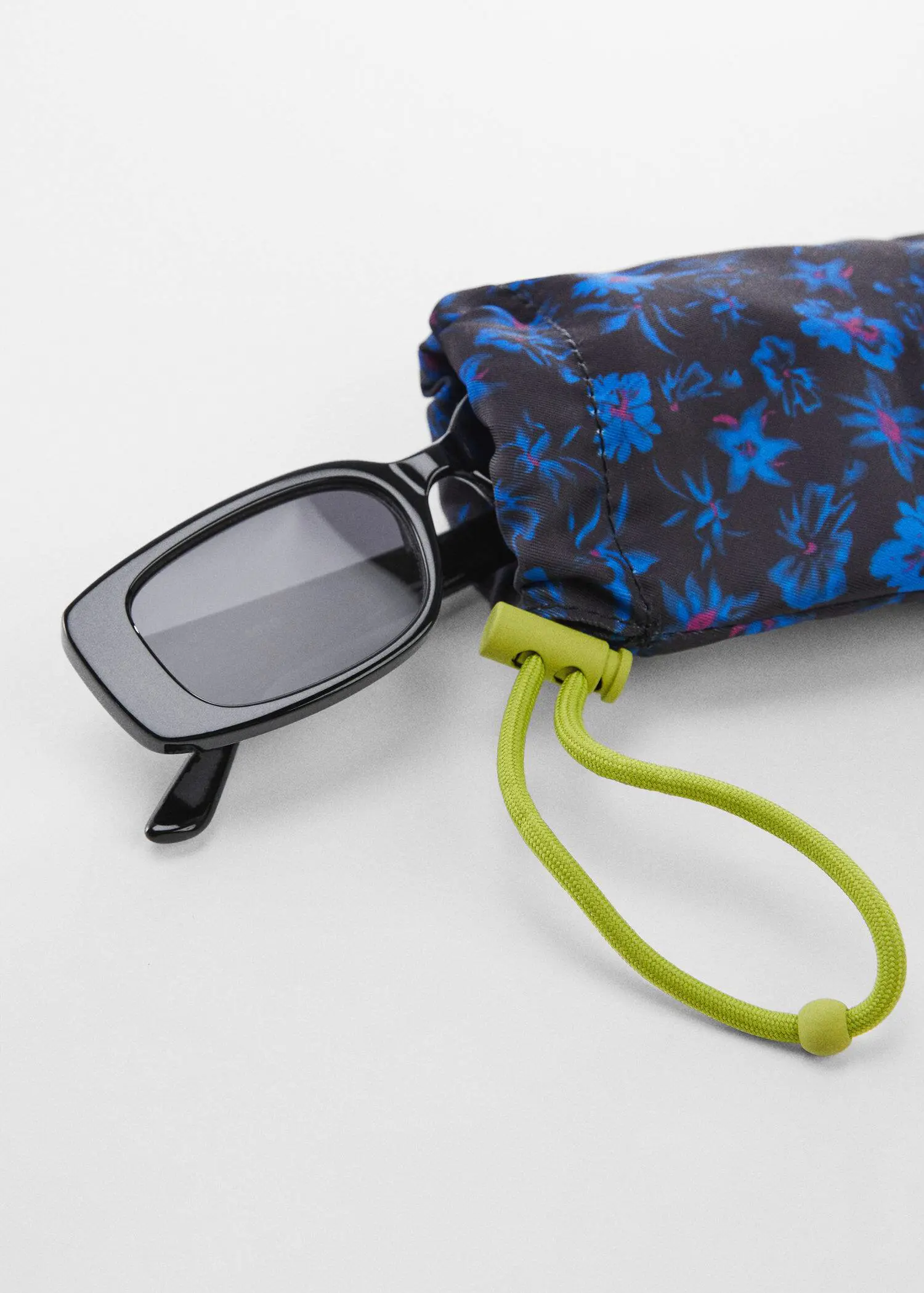 Mango Printed glasses case. a pair of glasses sitting on top of an umbrella. 