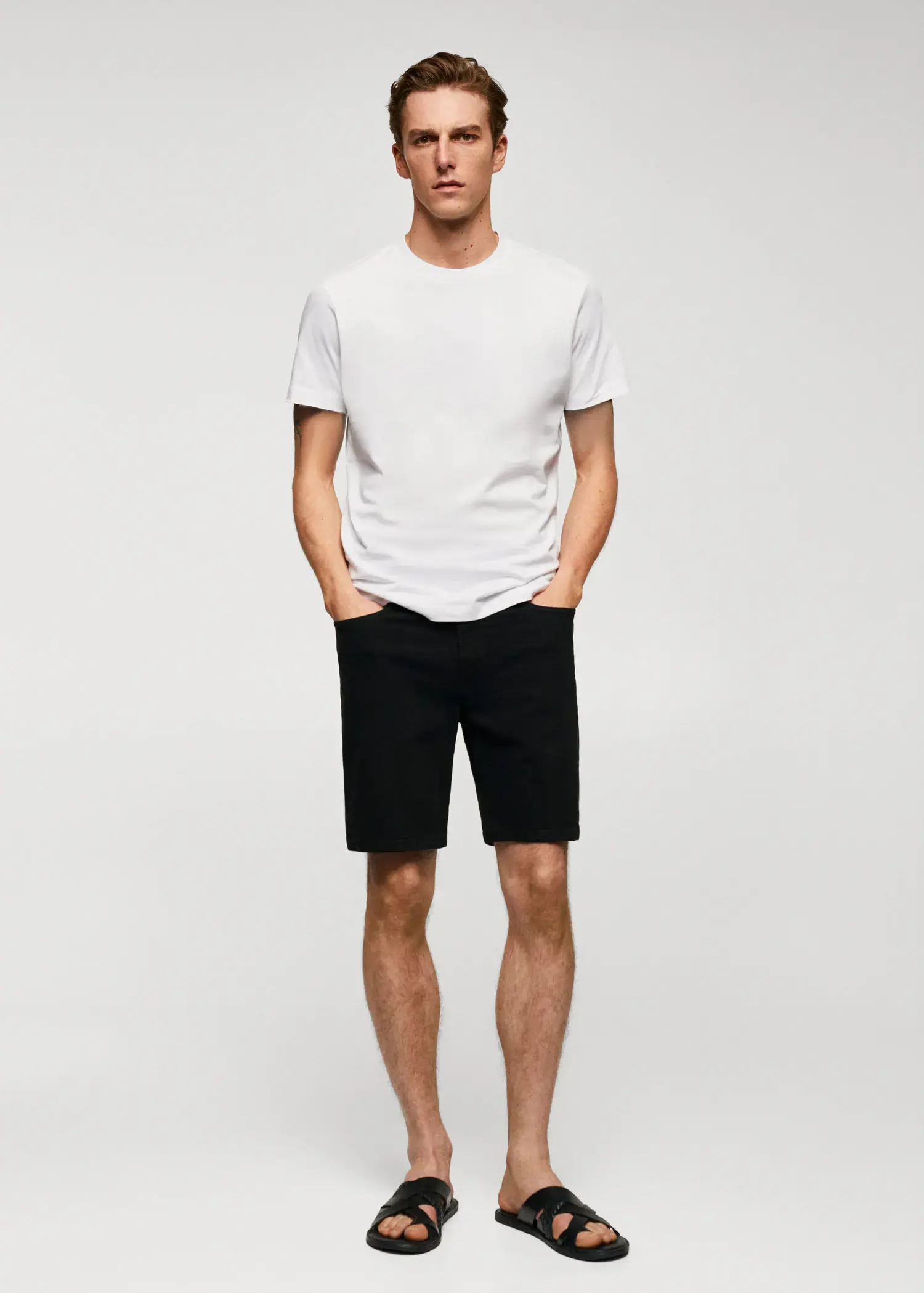 Mango Basic cotton stretch T-shirt. a man in white shirt and black shorts. 