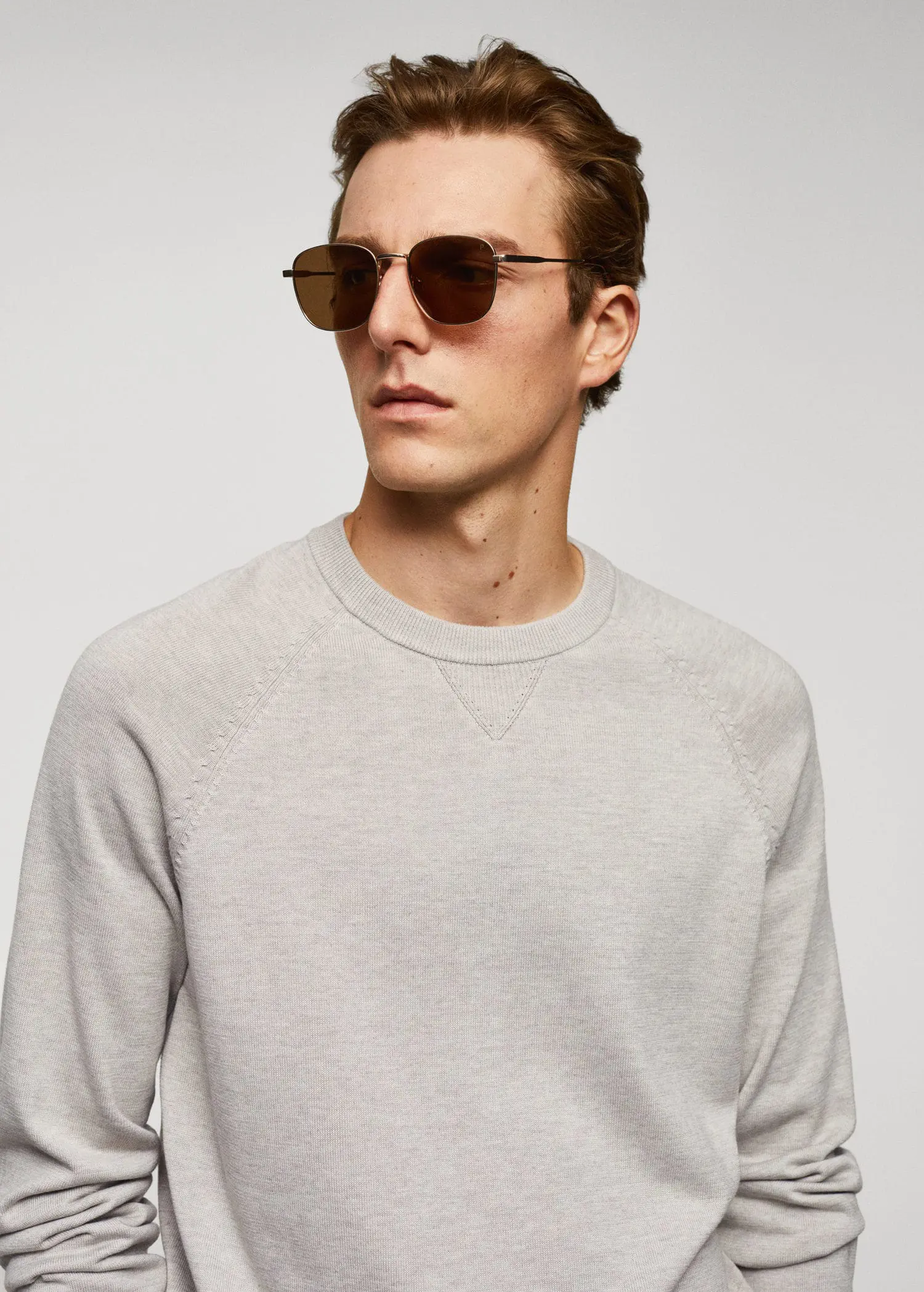 Mango Fine-knit cotton sweater. a man wearing sunglasses while standing in front of a white wall. 