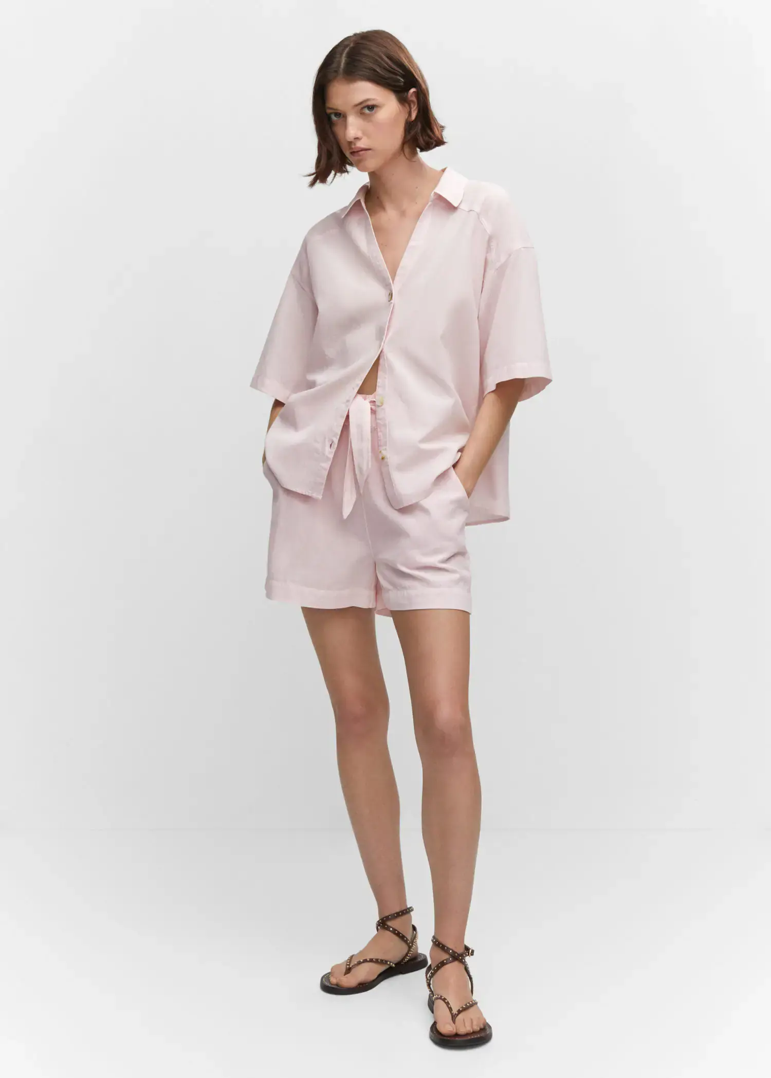 Mango Cotton linen-blend shirt. a woman wearing a pink shirt and shorts. 