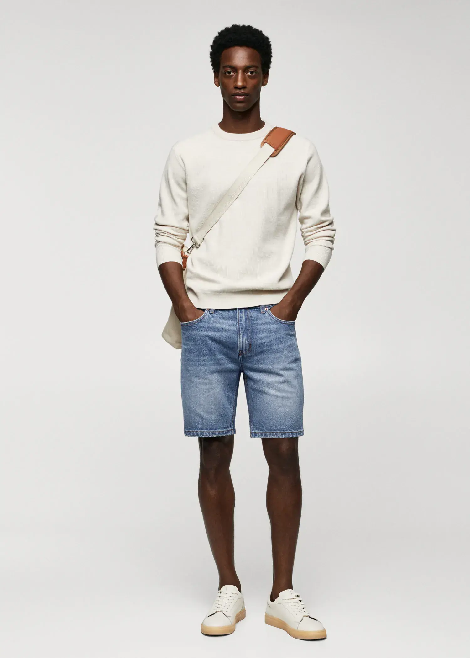 Mango Regular-fit denim bermuda shorts. a man in white sweater and blue denim shorts. 