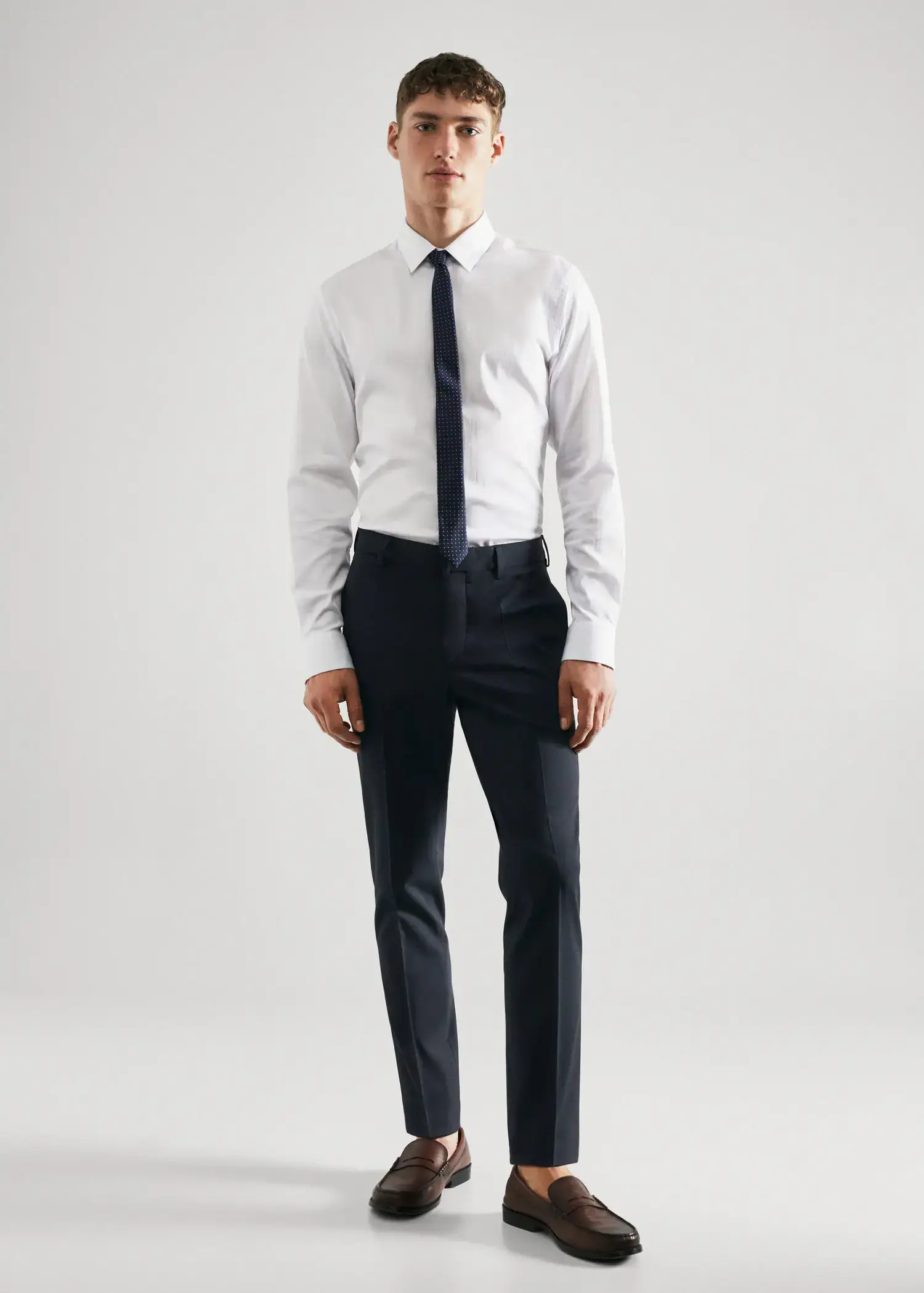 Mango Super slim fit suit trousers. a man in a white shirt and black pants. 