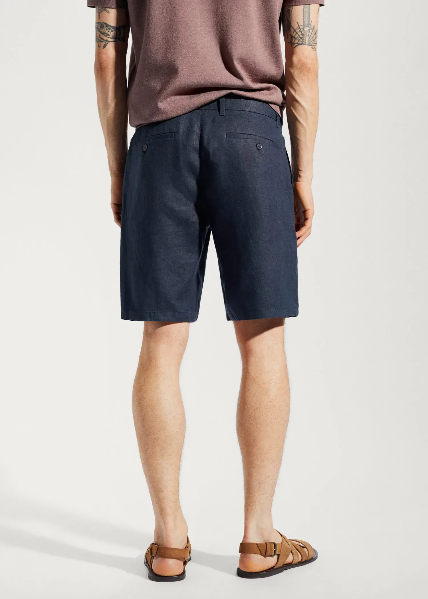Mango 100% linen shorts. a person wearing a pair of blue shorts. 