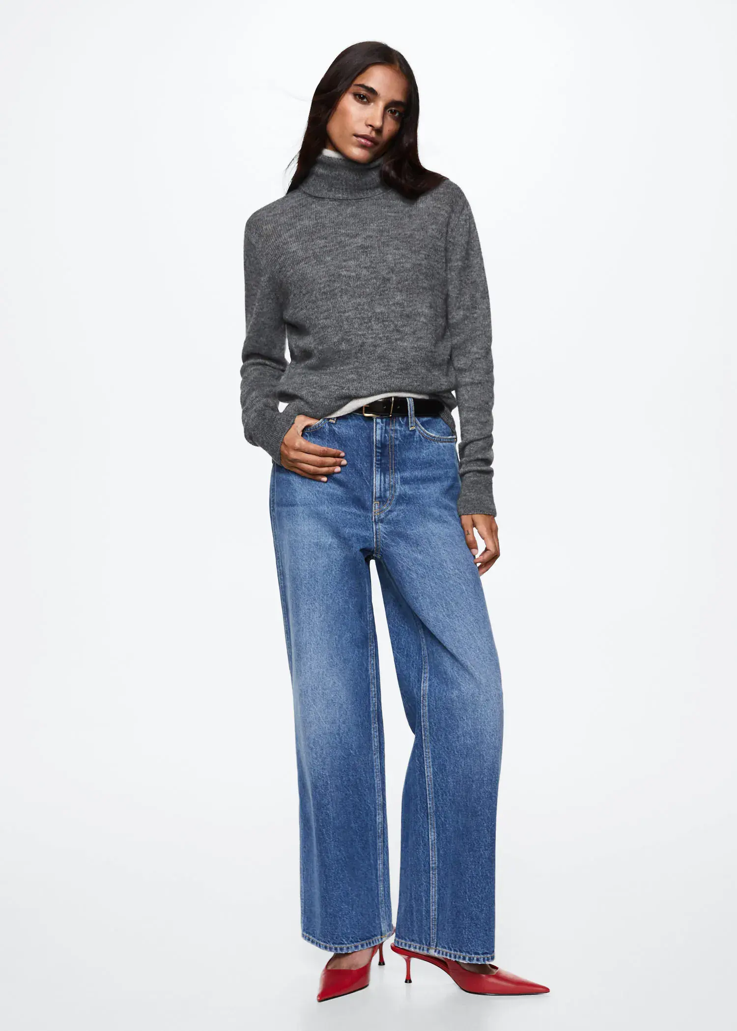 Mango Turtle neck sweater. a woman wearing a gray sweater and jeans. 