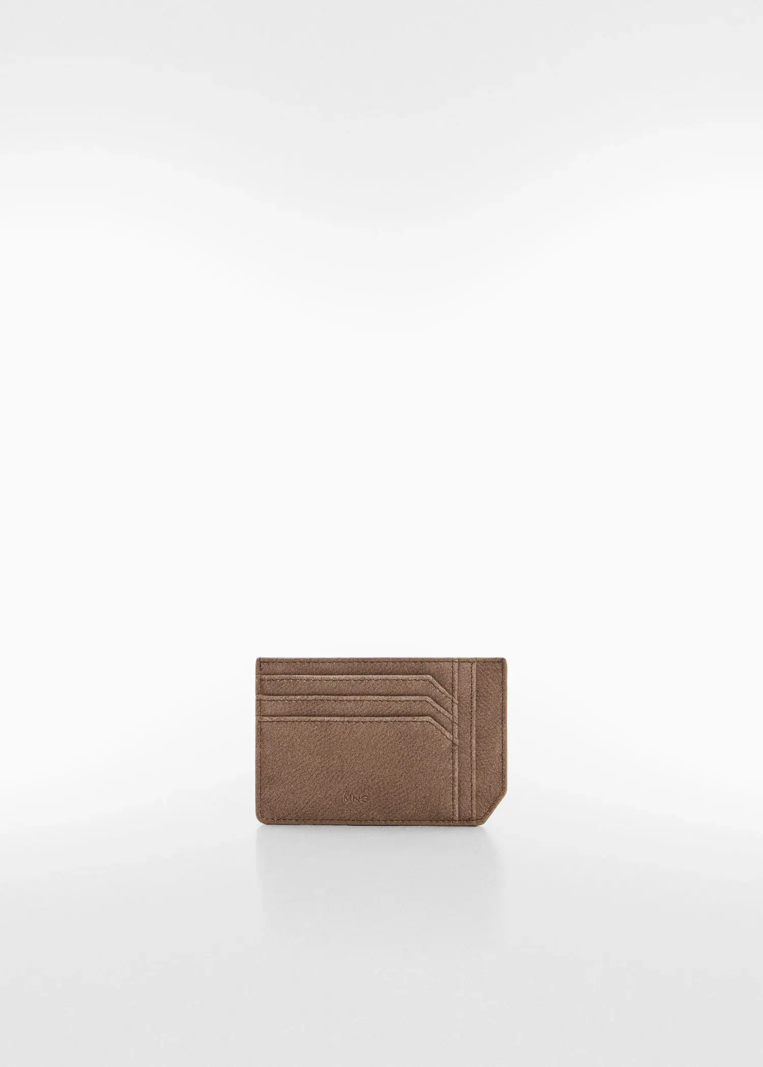 Mango Anti-contactless leather-effect card holder. a brown card holder sitting on top of a white table. 