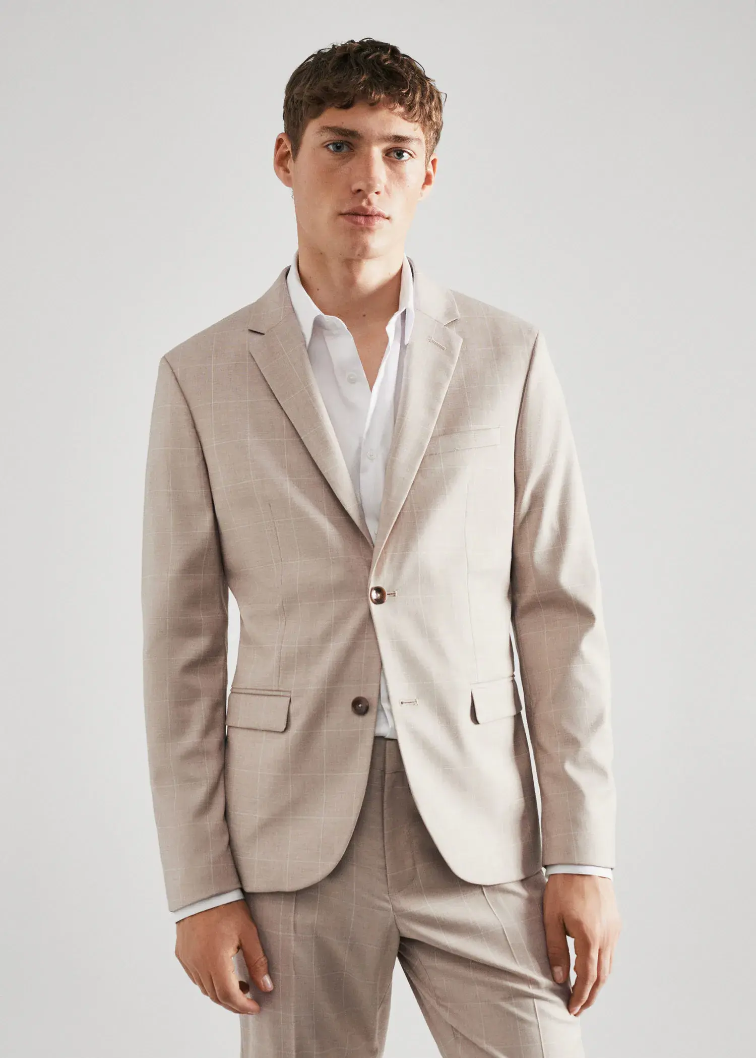 Mango Super slim-fit check suit jacket. a man wearing a suit and a white shirt. 