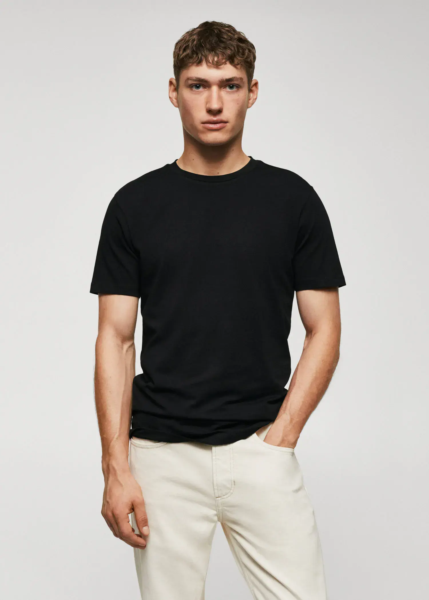 Mango Basic lightweight cotton t-shirt. a man in a black shirt and white shorts. 